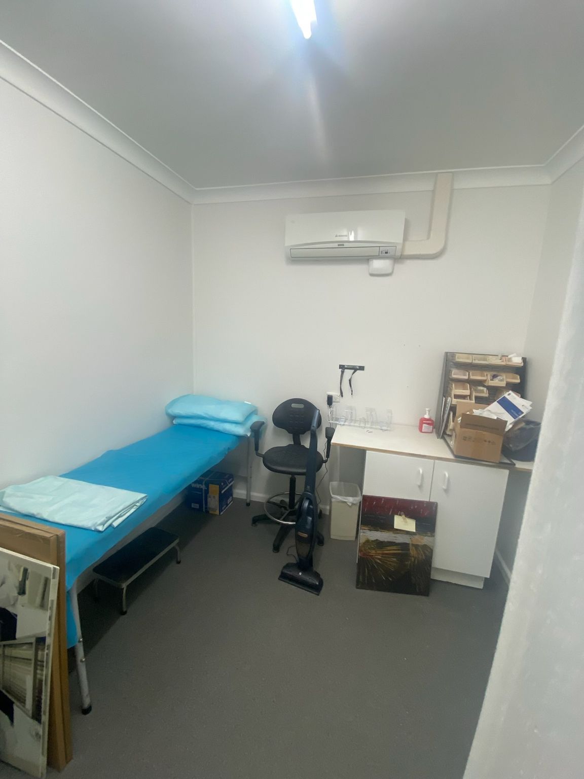 Small Clinic Exam Room With Blue Examination Table — Robert Seeliger Painter And Decorator in Gilgandra, NSW