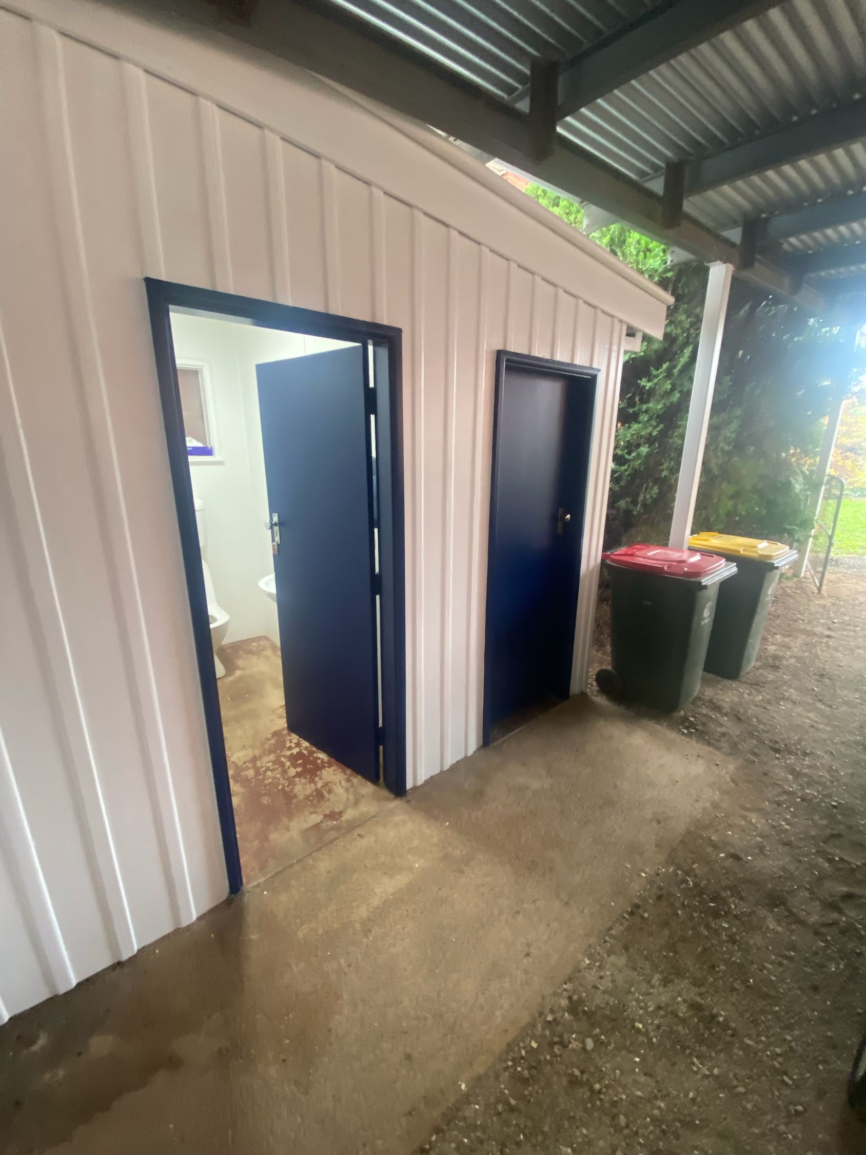An Outdoor Public Toilet Block With Two Doors — Robert Seeliger Painter & Decorator in Dubbo, NSW
