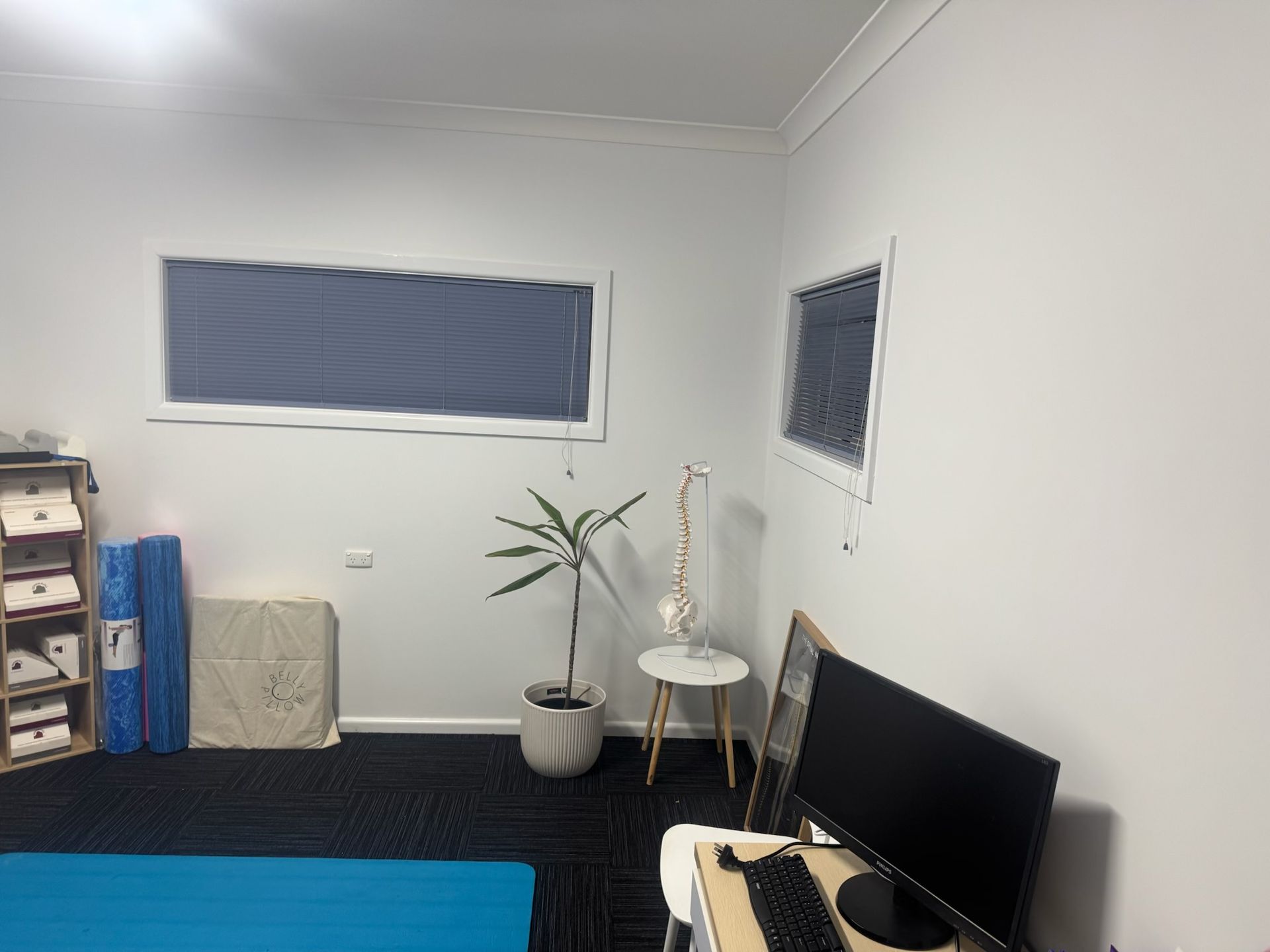 Small Sparsely Furnished Room With a Black TV and Covered Windows — Robert Seeliger Painter And Decorator in Dubbo, NSW