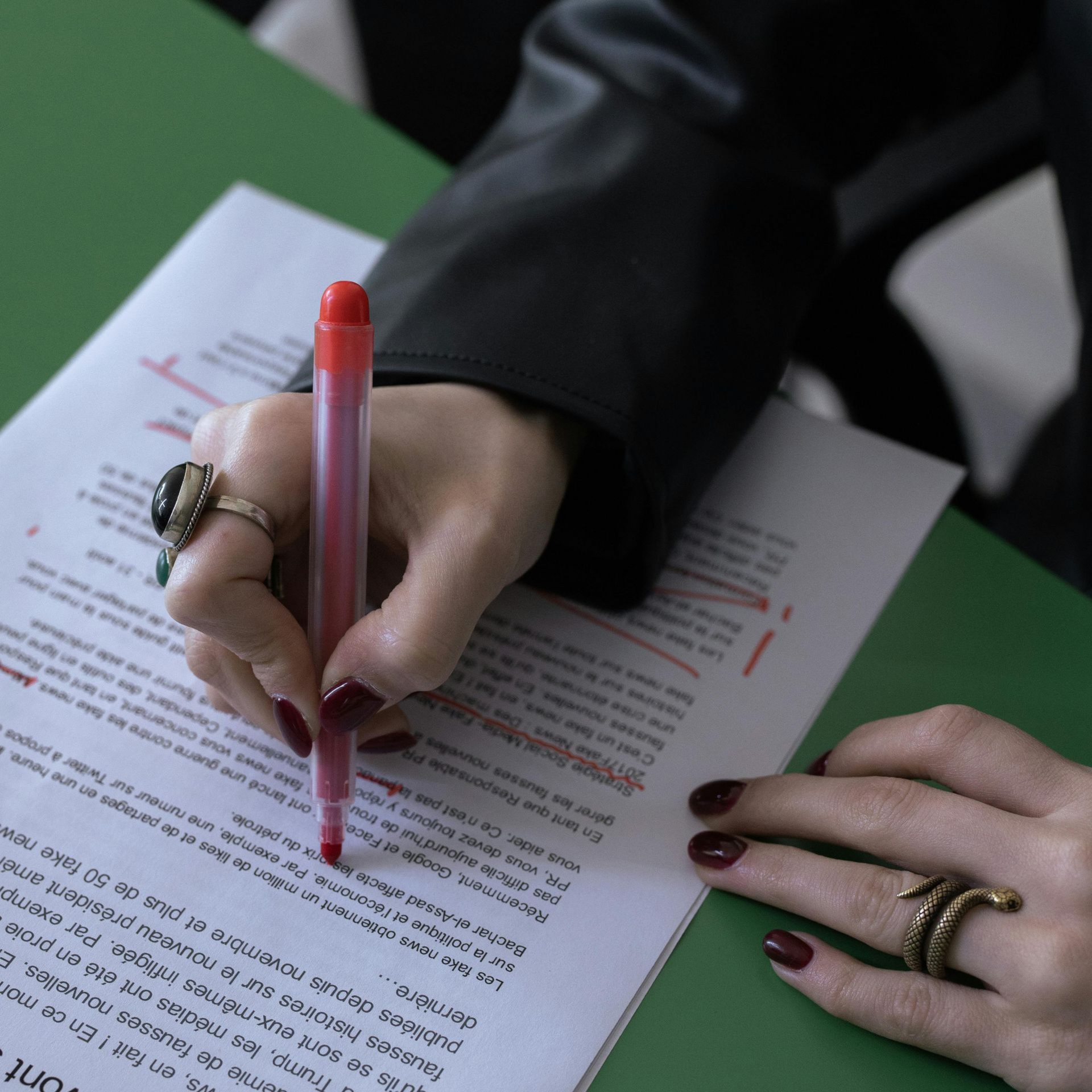 Hand writing on printed text with a red pen, representing the Word Dragon editing service 
