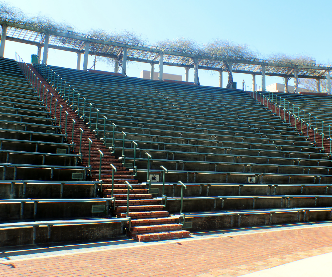 An empty stadium with stairs leading up to the top