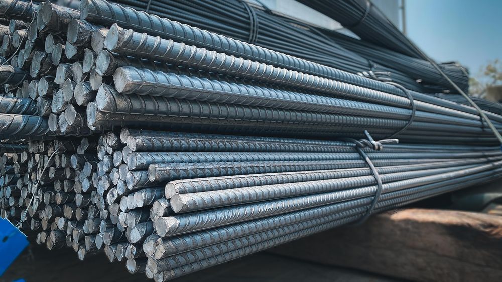 A bunch of steel bars are stacked on top of each other.