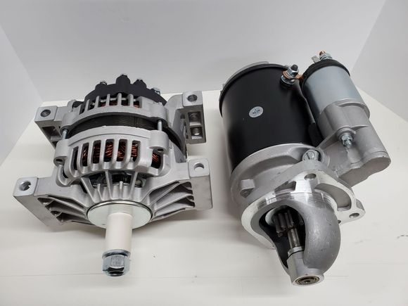 Row of automotive alternators on a workbench in a garage or repair shop