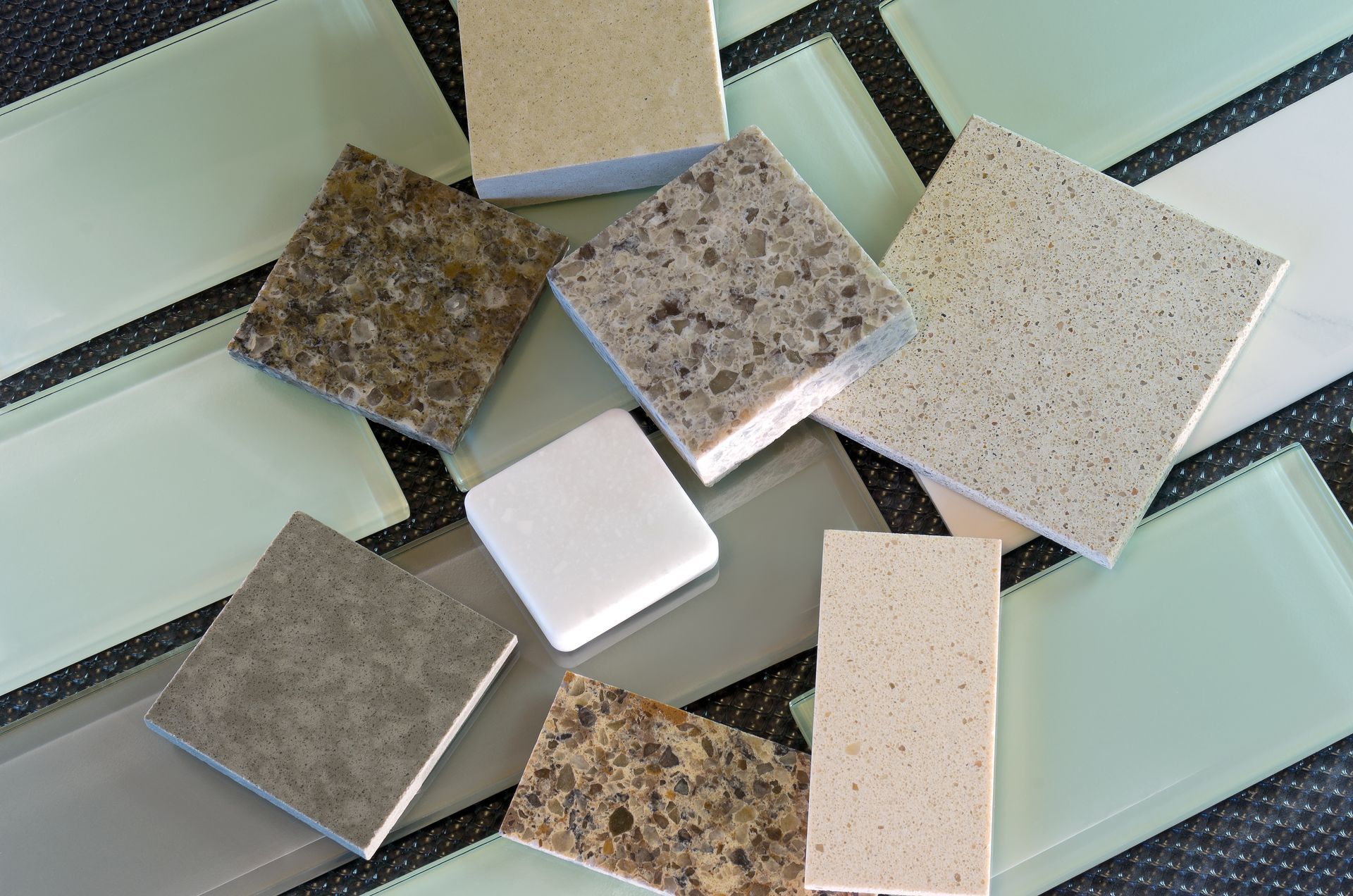 A bunch of different types of tiles on a table