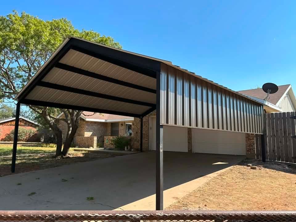 Covered carport with corrugated metal roof and black posts in a suburban yard