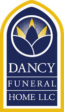 Dancy Funeral Home LLC logo with blue and gold arched floral emblem and white text