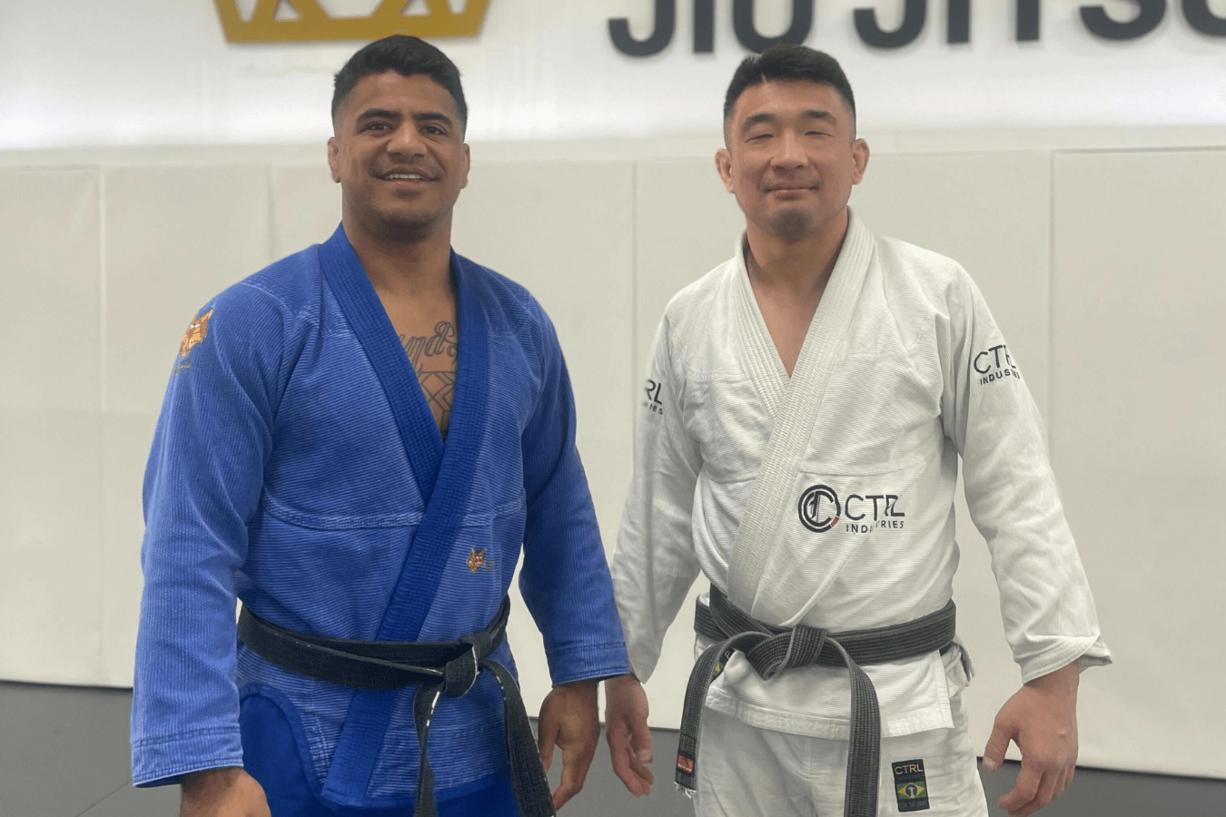 Partners drill brazilian jiu jitsu guard passing at Royal Jiu-Jitsu Queens in Queens, NY, building confidence.