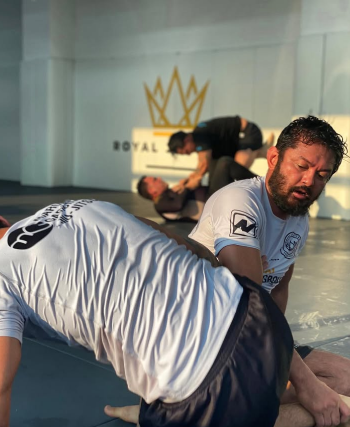 Adult students drilling brazilian jiu jitsu at Royal Jiu-Jitsu Queens in Queens, NY for stress relief and fitness.
