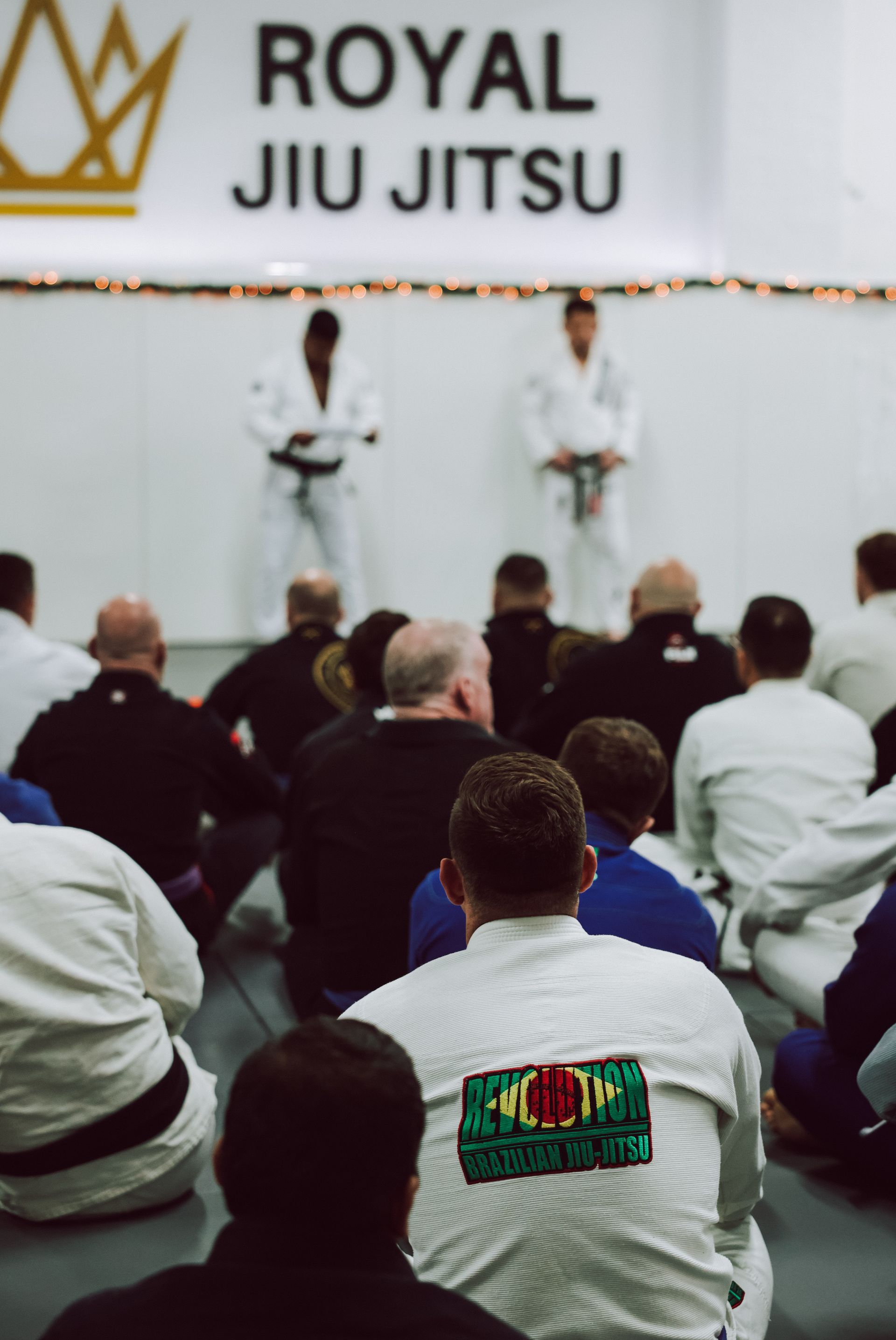 Adults drilling Brazilian Jiu-Jitsu technique at Royal Jiu-Jitsu Queens in Queens, NY, building fitness and community.