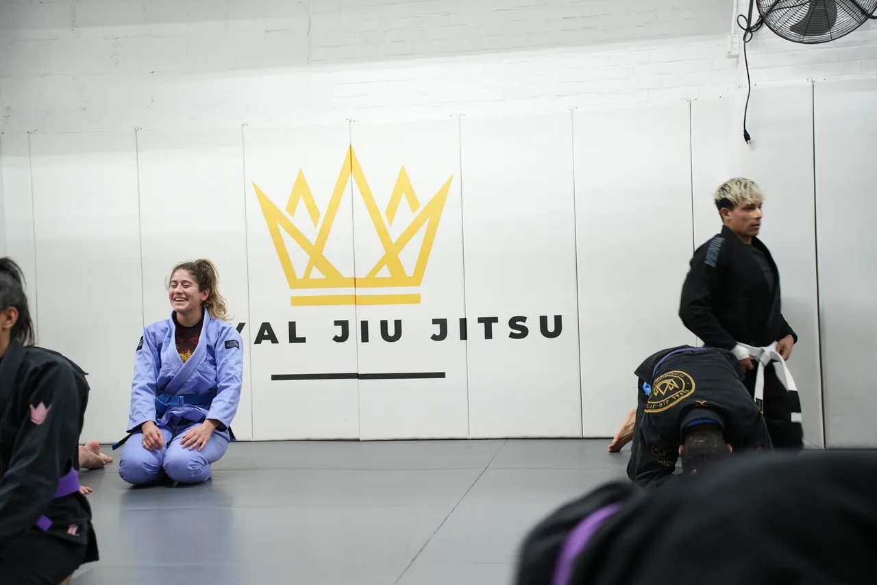 Beginners practicing positional control at Royal Jiu-Jitsu Queens in Queens, NY, building confidence safely.