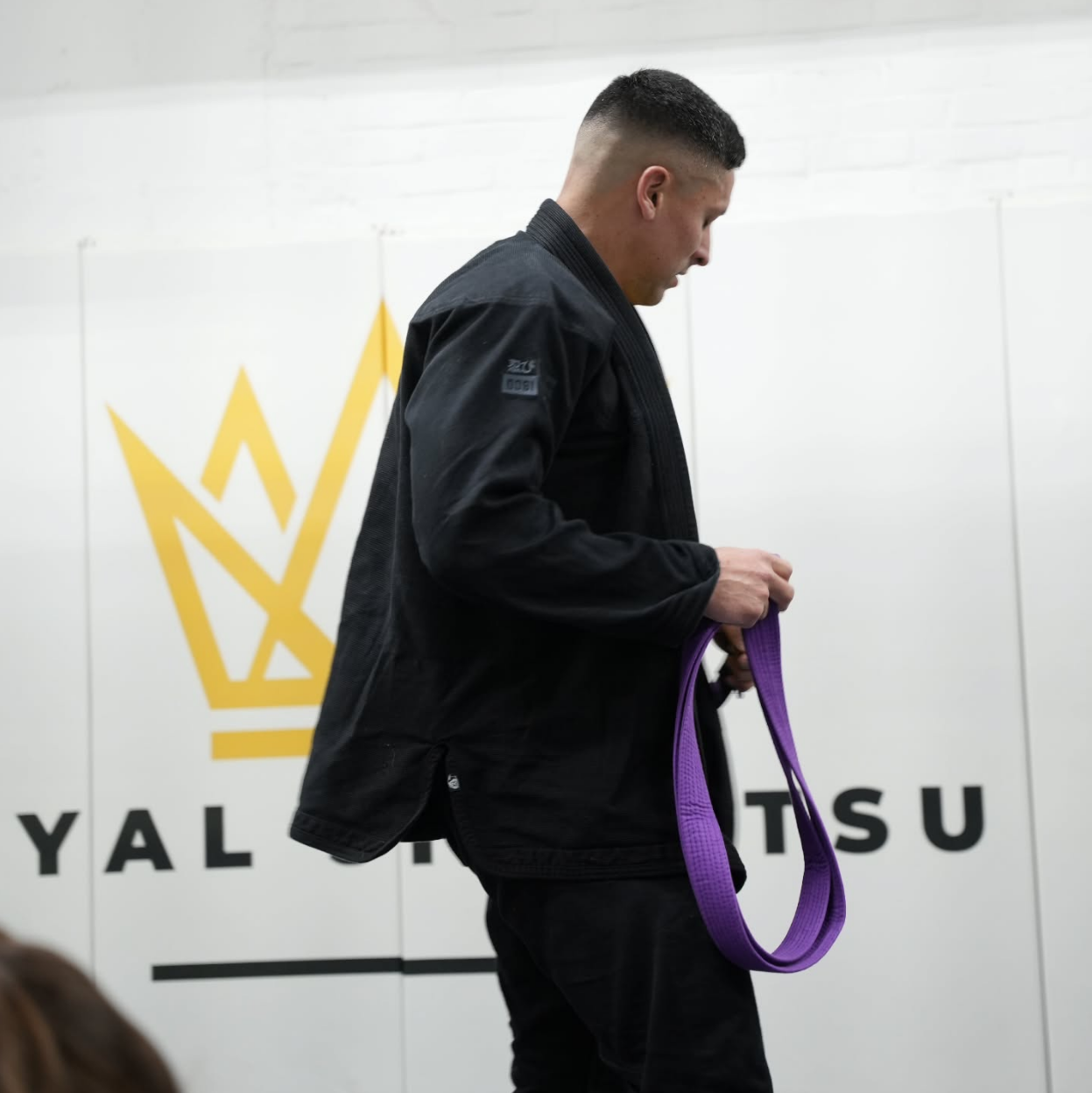 Adults drilling Brazilian Jiu Jitsu technique at Royal Jiu-Jitsu Queens in Queens, NY.