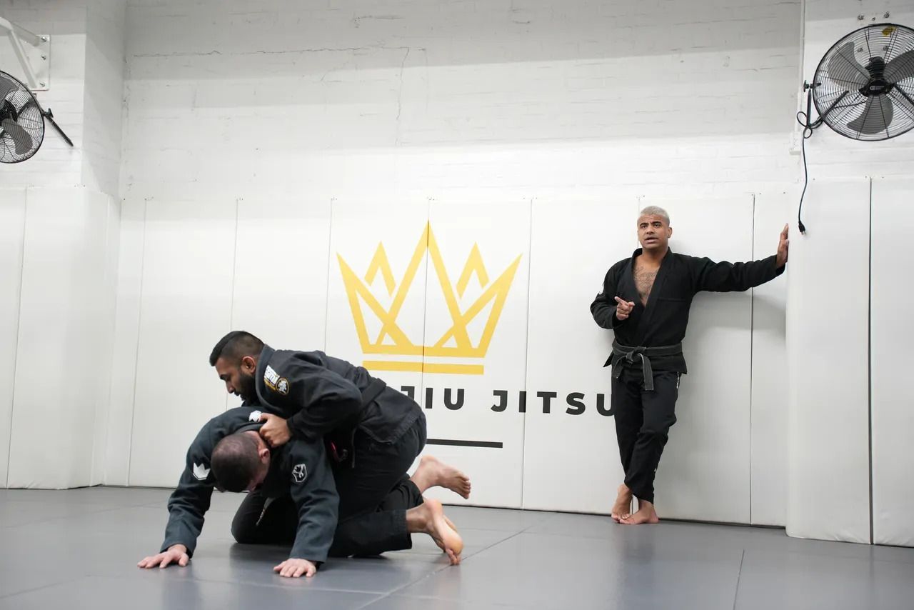 Adults practicing controlled grappling at Royal Jiu-Jitsu Queens in Queens, NY.
