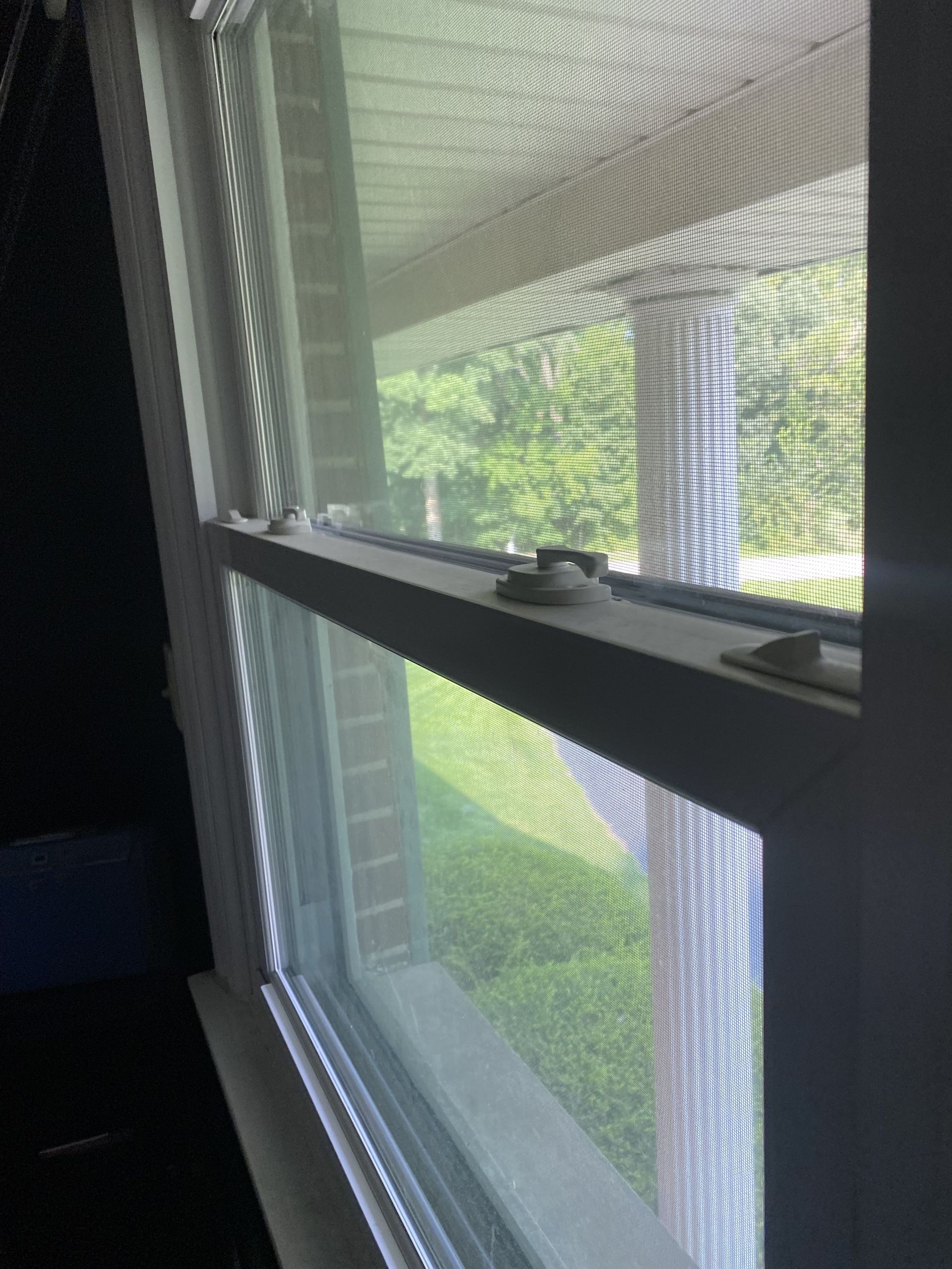 a close up of a window with a screen on it .