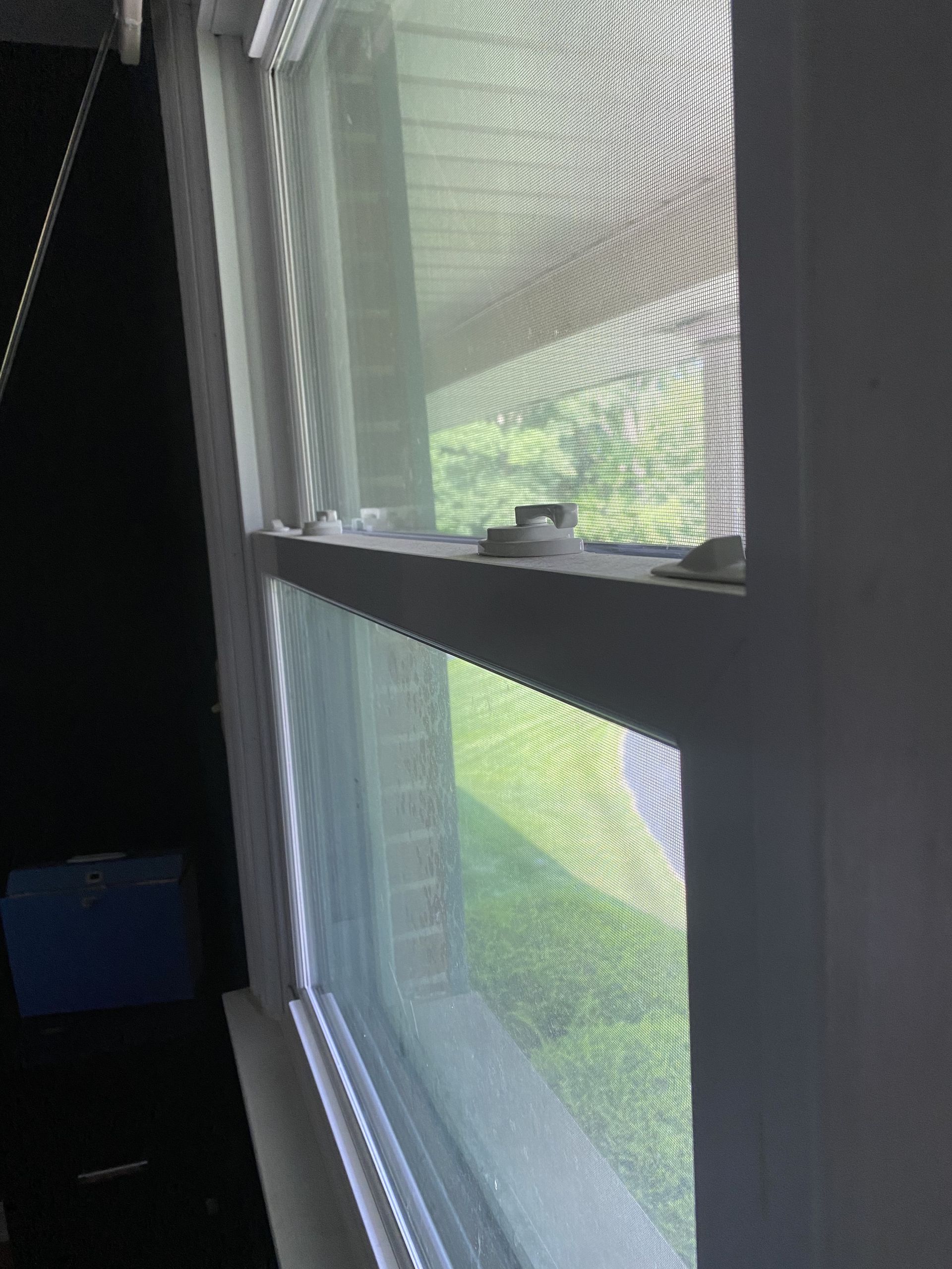 a close up of a window with a screen on it .