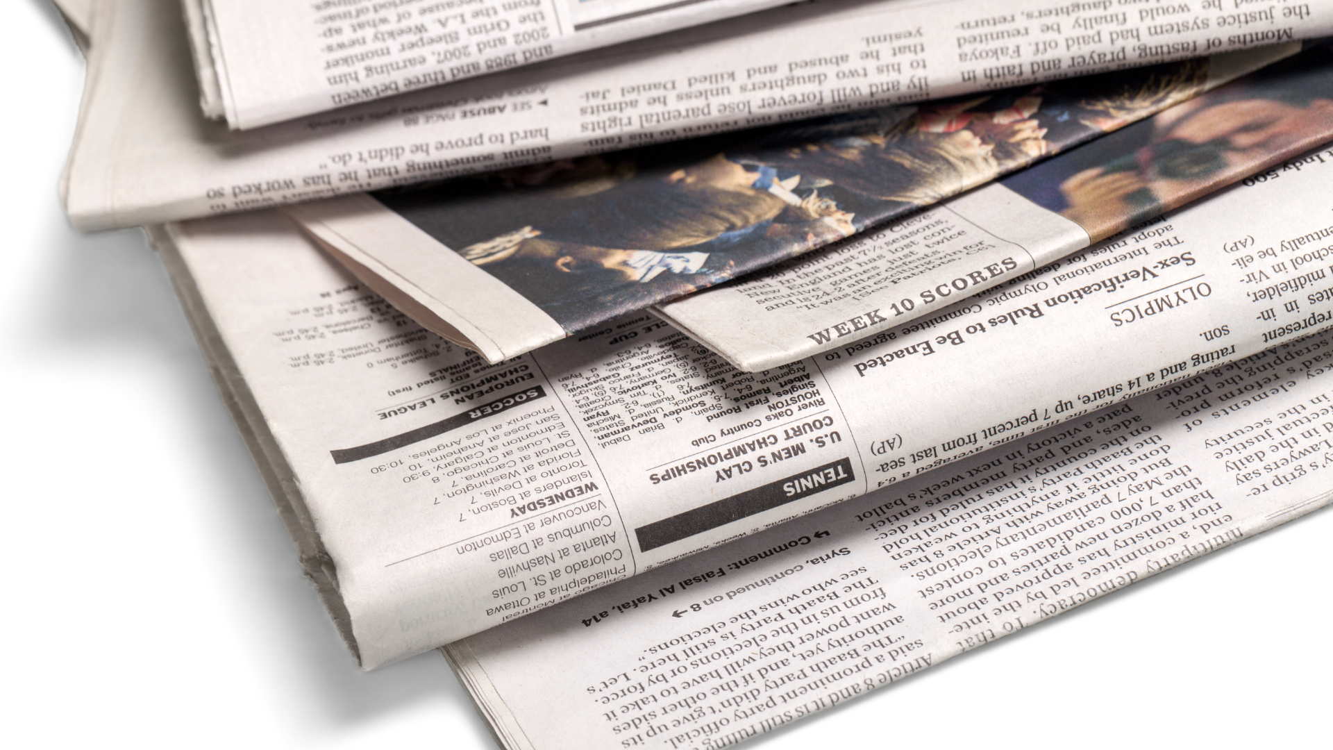 A stack of newspapers on a white background