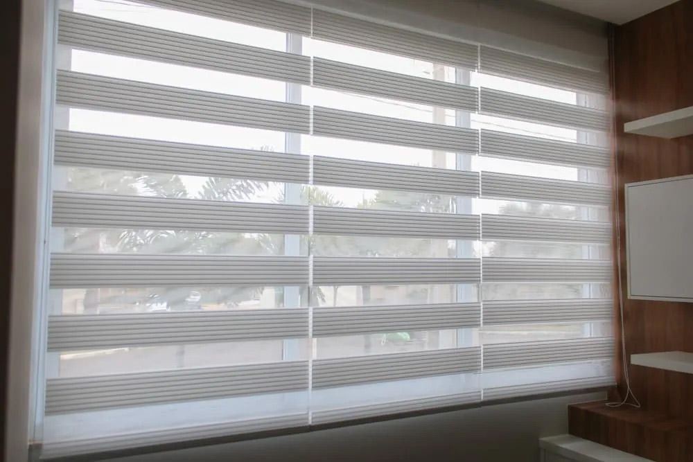 A Window With a Zebra Blind on It in a Room — Cover Me NQ in Currajong, QLD