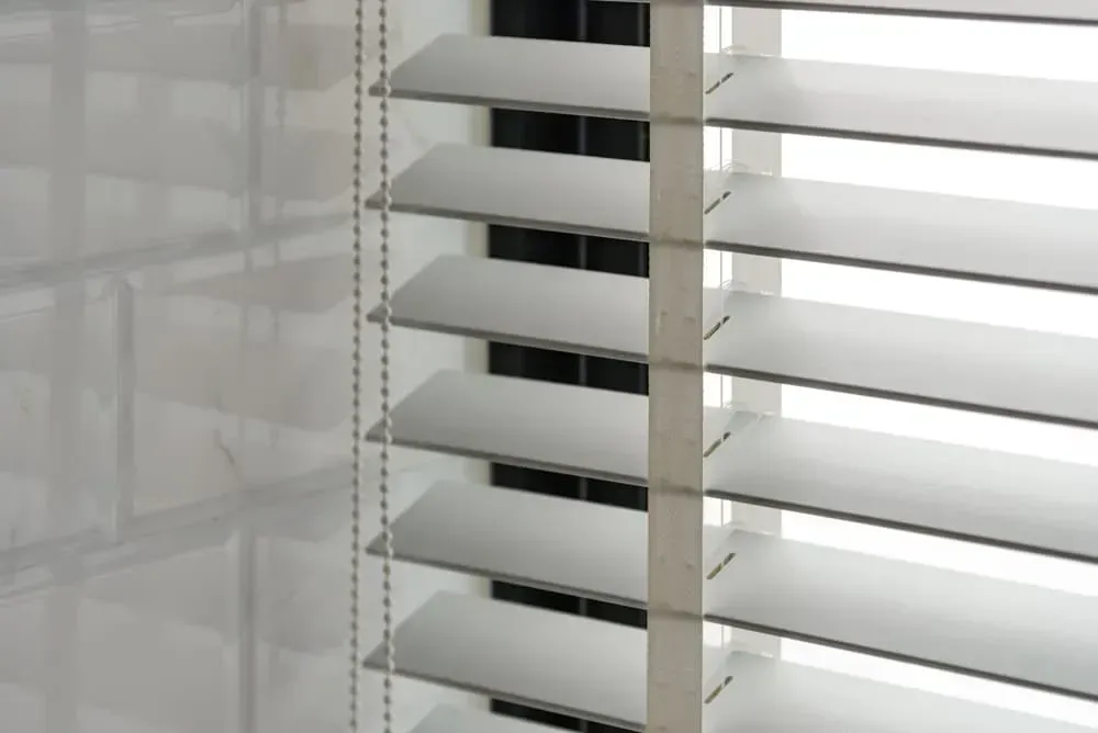 A Close Up of a Window With Blinds on It — Cover Me NQ in Currajong, QLD