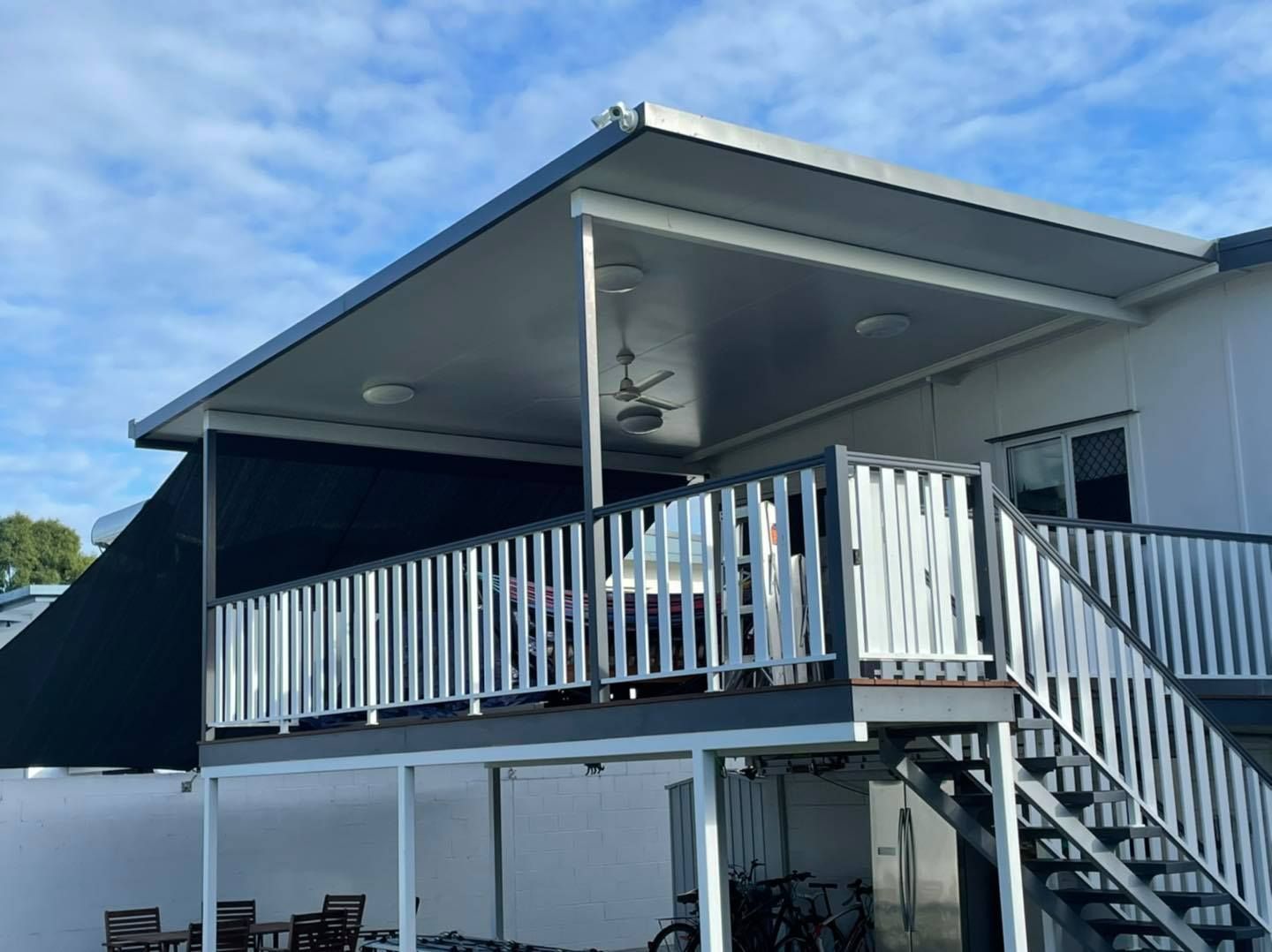 A White House With a Large Deck and Stairs — Cover Me NQ in Currajong, QLD