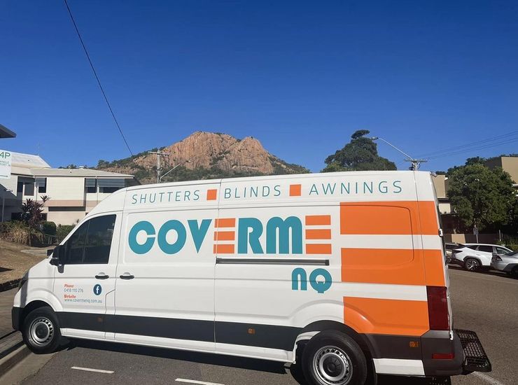 A White Van With the Word Coverm on It is Parked in a Parking Lot — Cover Me NQ in Currajong, QLD