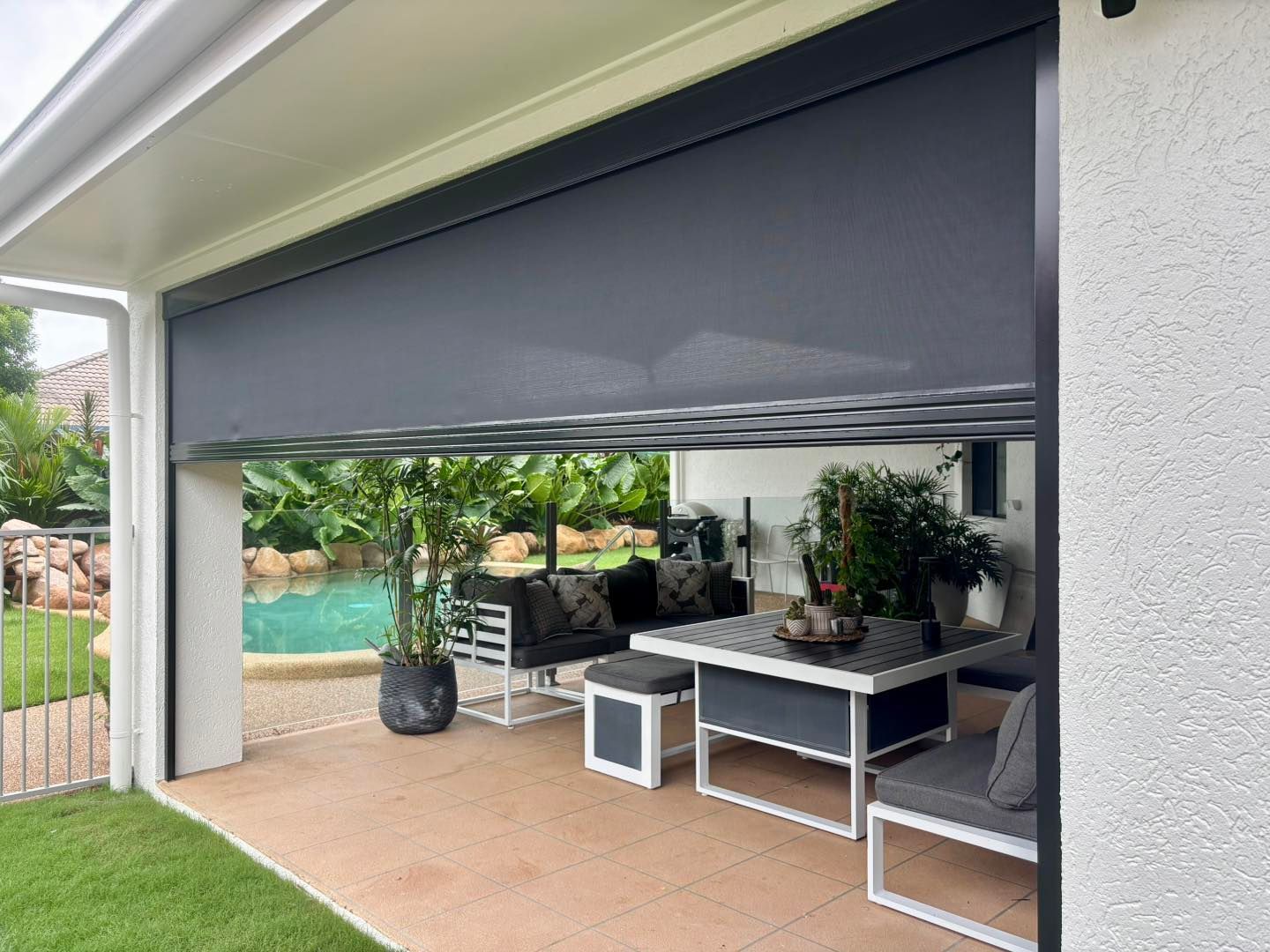 A Screened in Porch With a Fence and Black Blinds — Cover Me NQ in Currajong, QLD