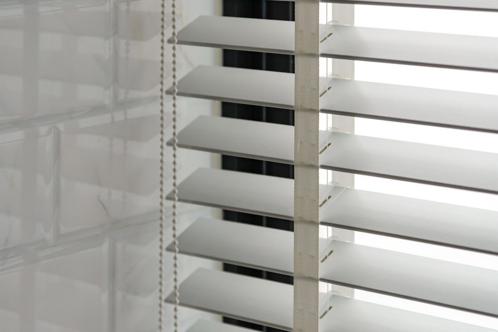 A Close Up of a Window With Blinds on It — Cover Me NQ in Currajong, QLD