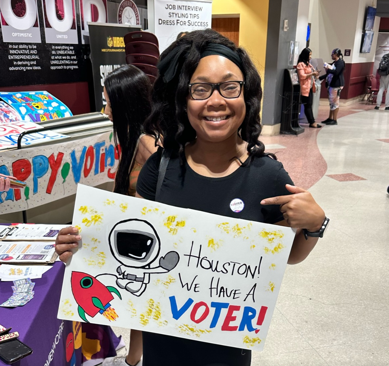 A college student proudly displays her