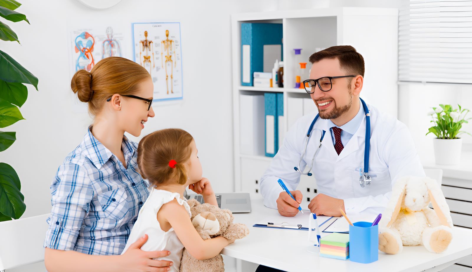 A Woman is Holding a Little Girl While Talking to a Doctor — Newcastle Paediatric Occupational Therapy In Floraville, NSW