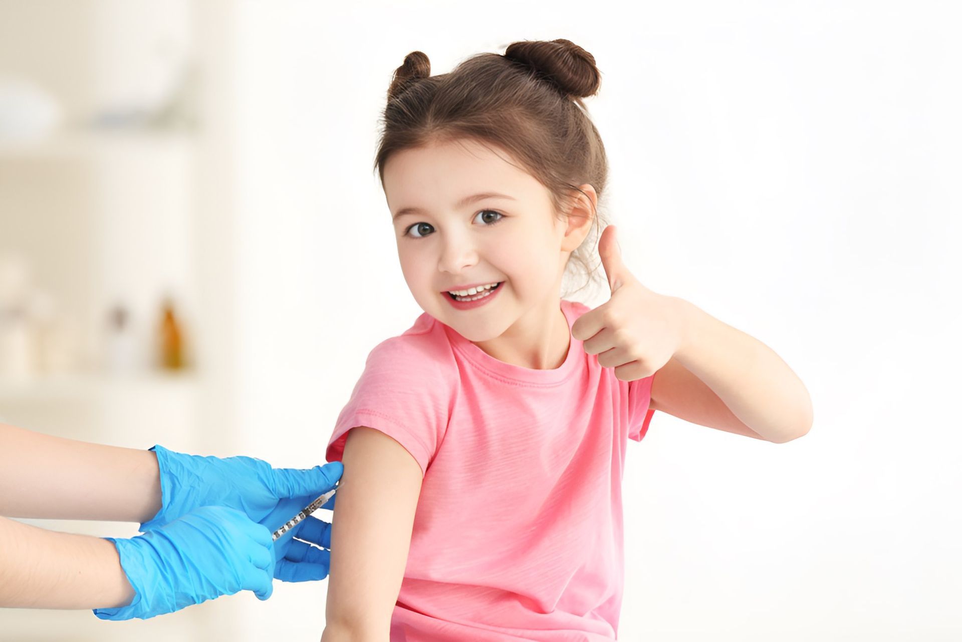A Little Girl is Getting an Injection in Her Arm— Newcastle Paediatric Occupational Therapy in Belmont, NSW