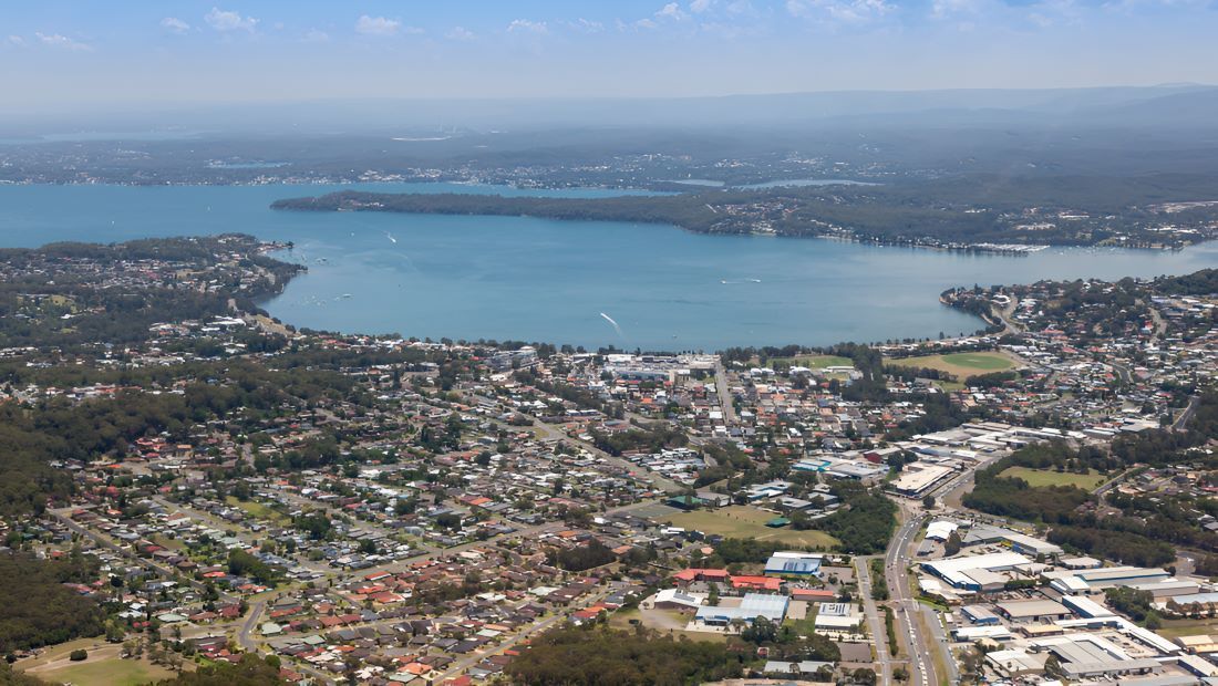 An Aerial View of a City With a Lake in the Background — Newcastle Paediatric Occupational Therapy in Lake Macquarie, NSW