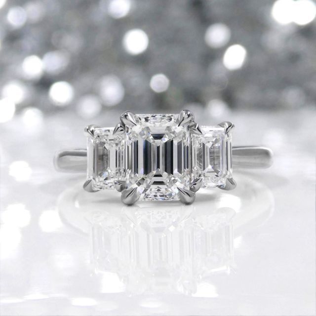 kimberfire three stone emerald cut engagement ring