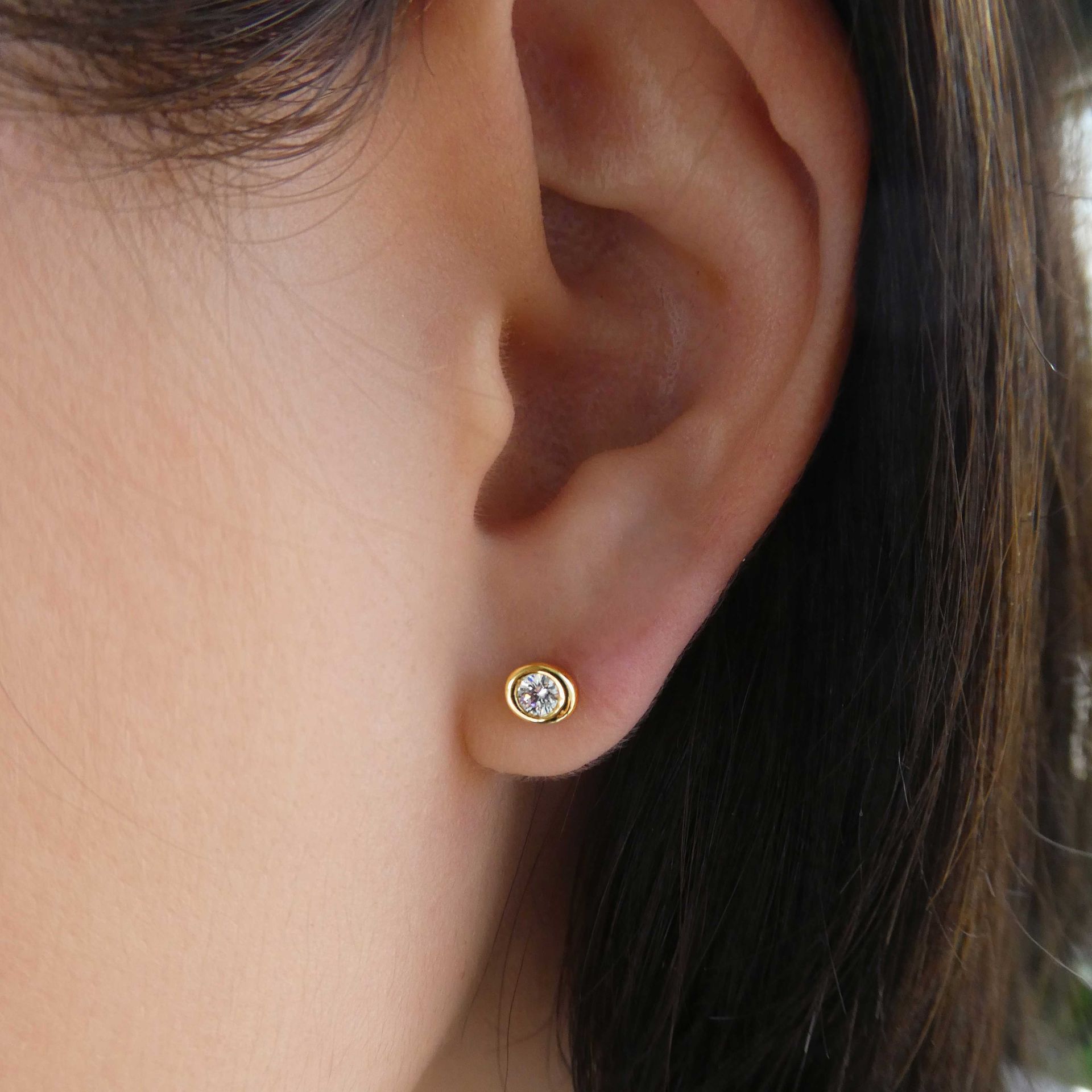 Kimberfire Pebble earrings in yellow gold.
