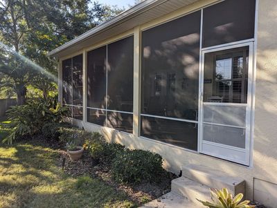 Screened room with patio furniture