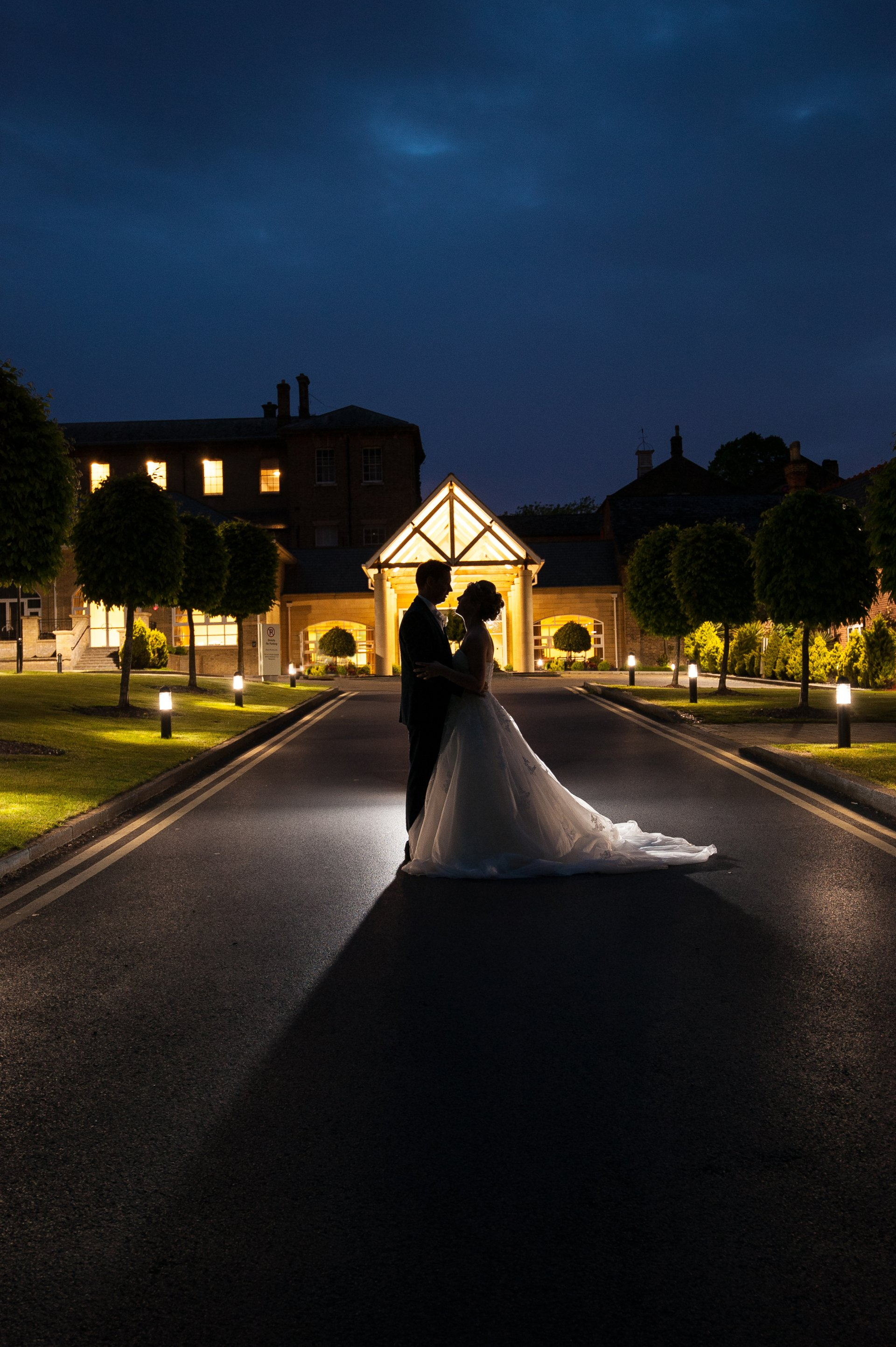 Bride and Groom Silhouette as they look into each other 's eye's shot at night