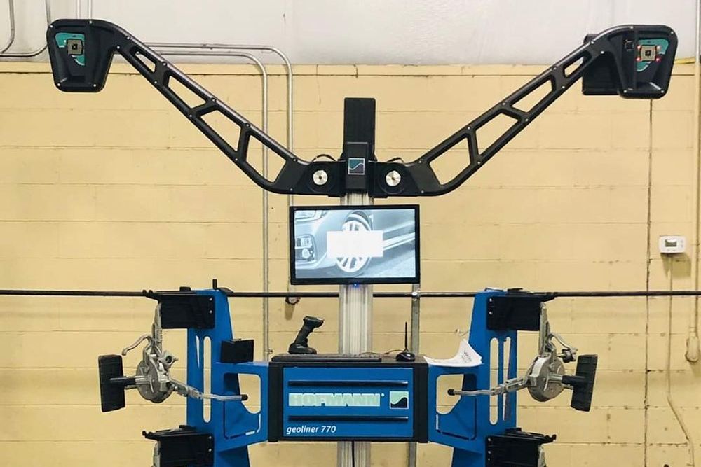 Wheel alignment machine in a garage | Old School Automotive & Tire