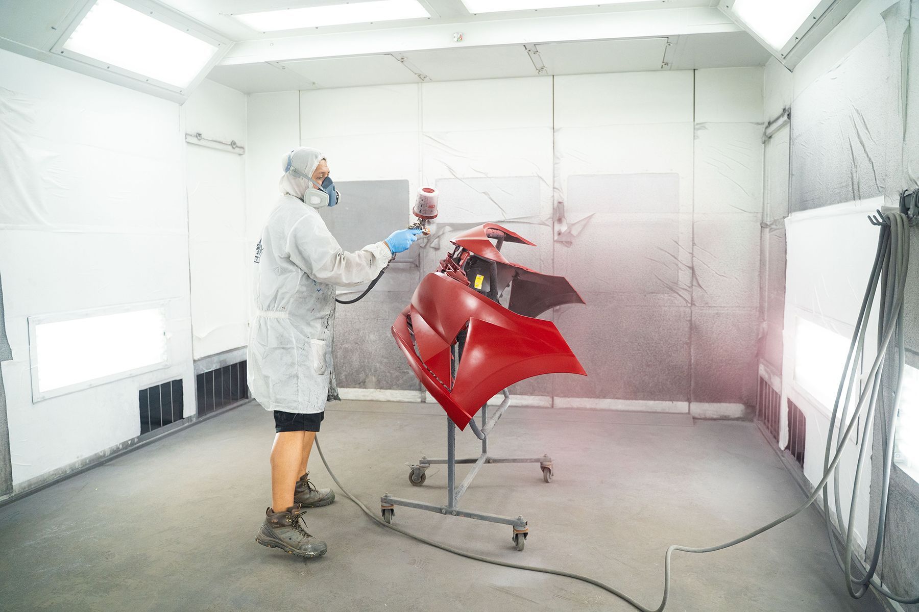 Coating red paint on front of car in Fishkill, NY | Jimmy's Auto Outlet