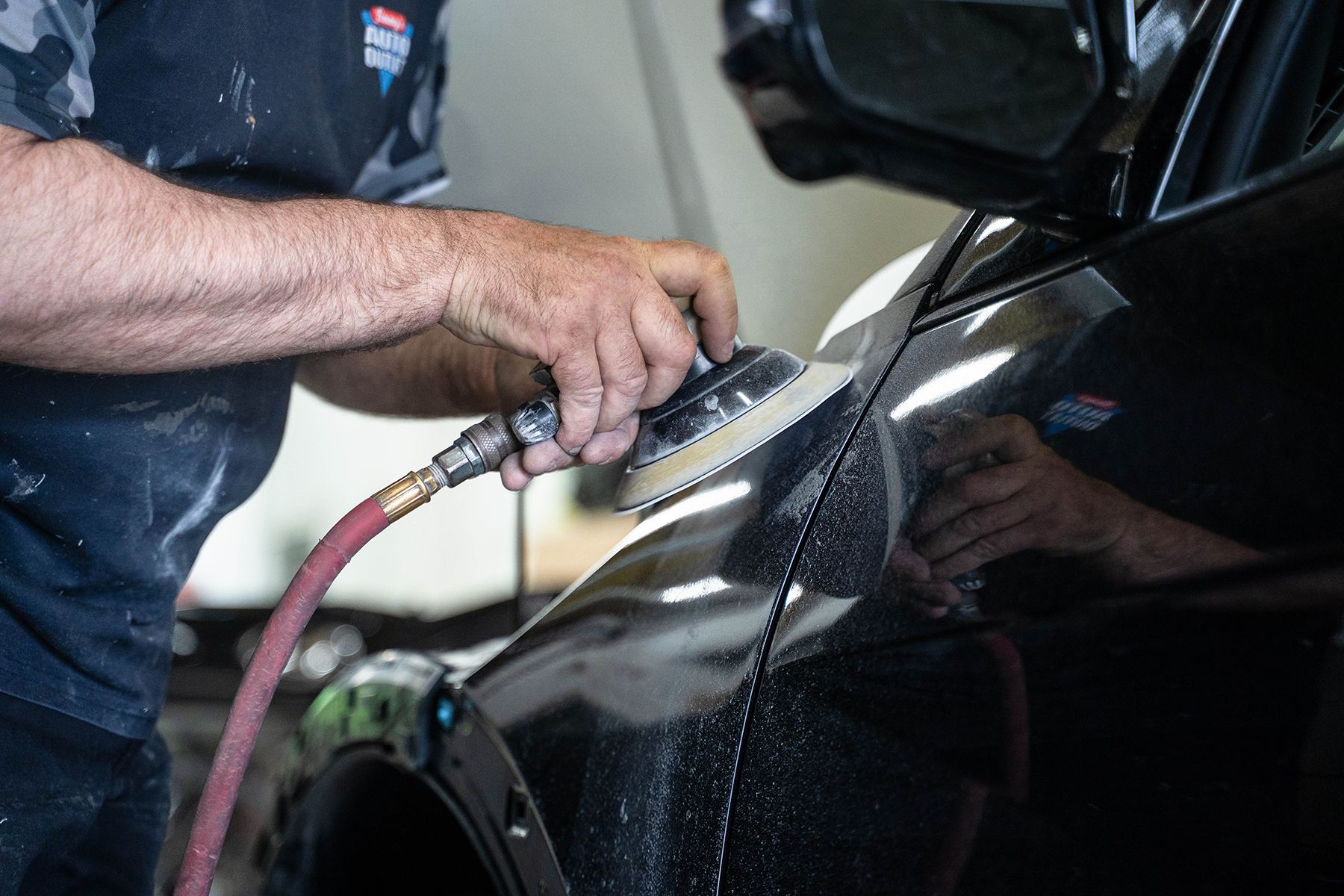 Detailing black car inside our garage in Fishkill, NY | Jimmy's Auto Outlet