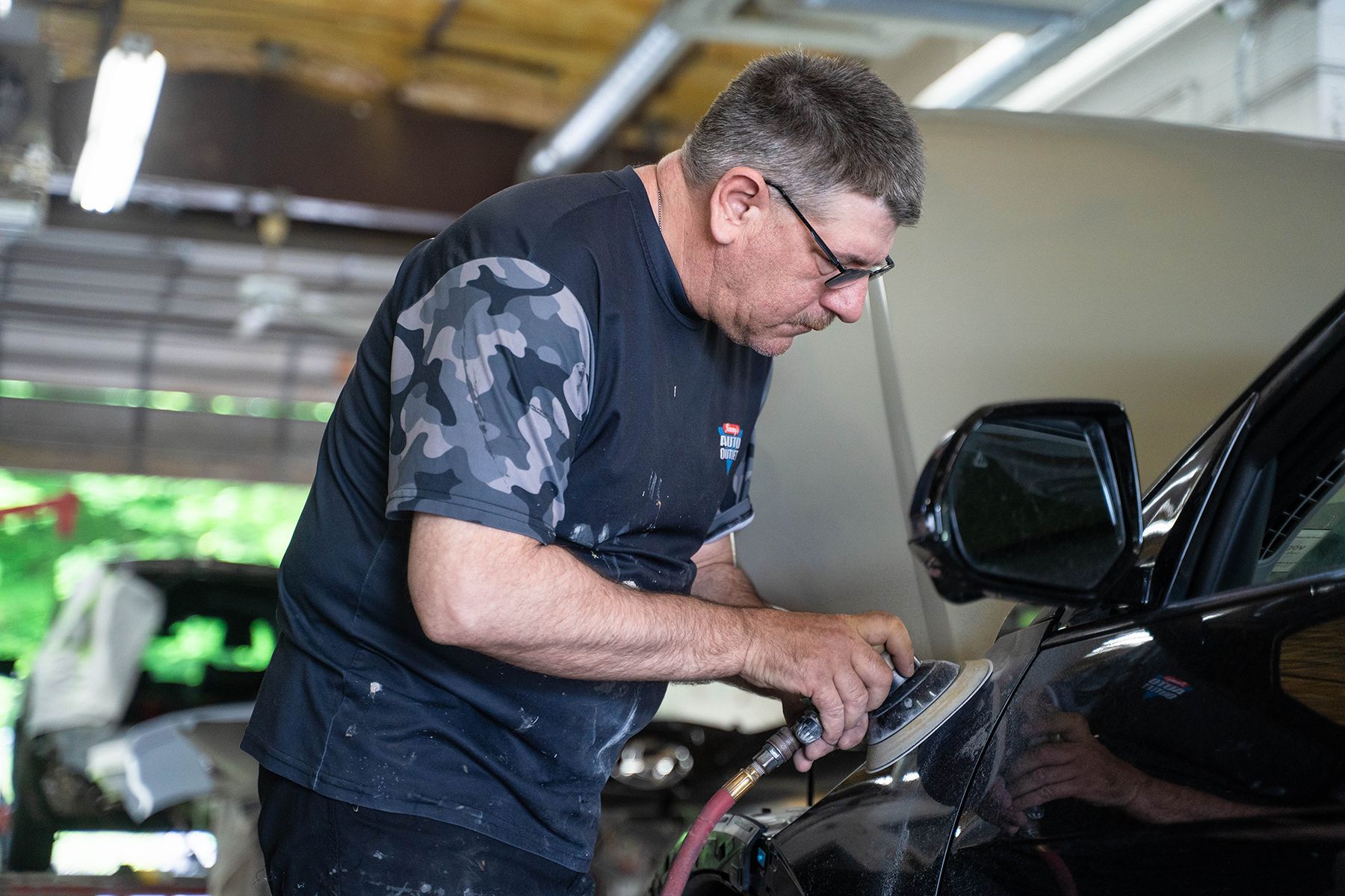 Detailing black car inside our garage in Fishkill, NY | Jimmy's Auto Outlet