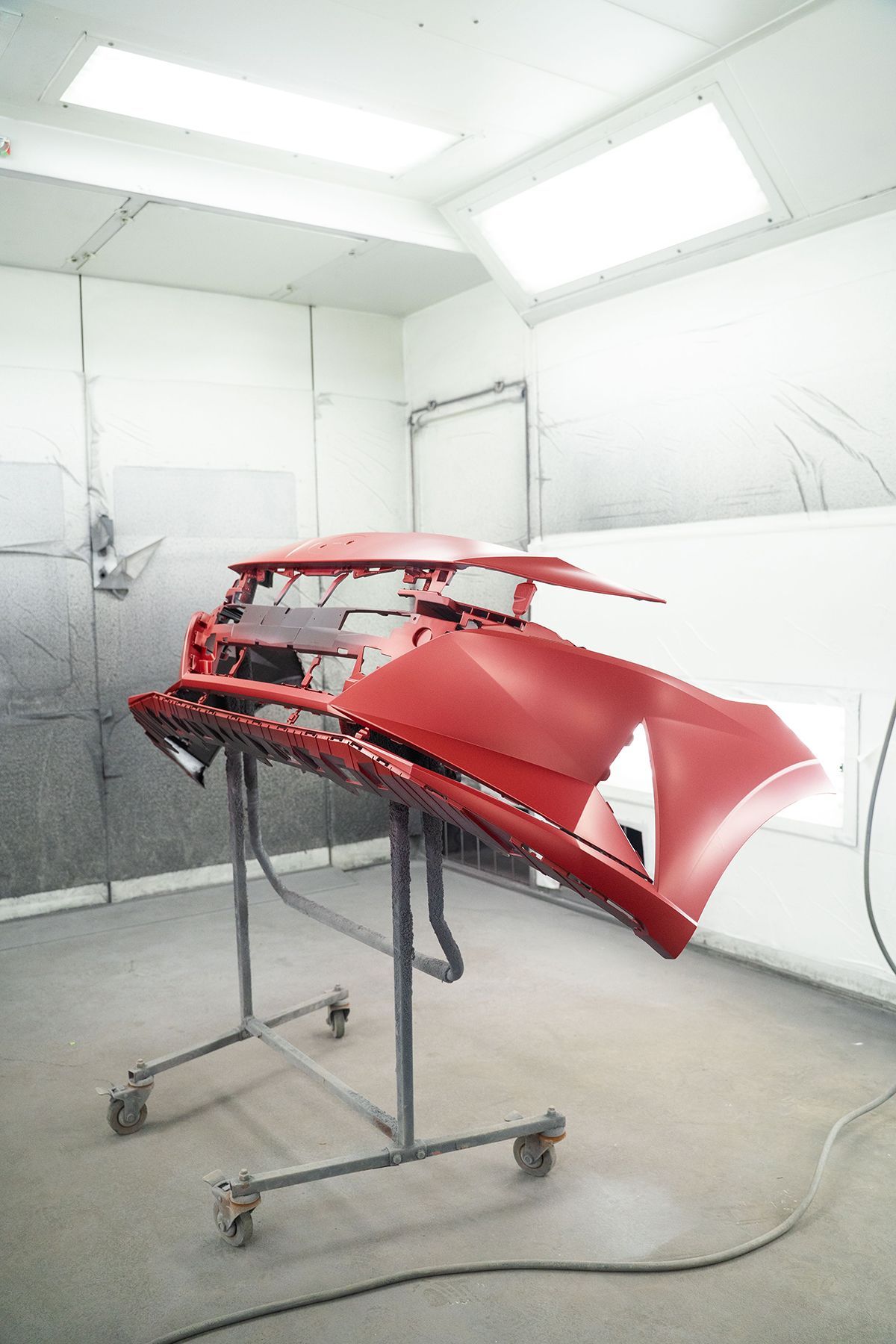 Front of red car prepared for red paint coating in Fishkill, NY | Jimmy's Auto Outlet