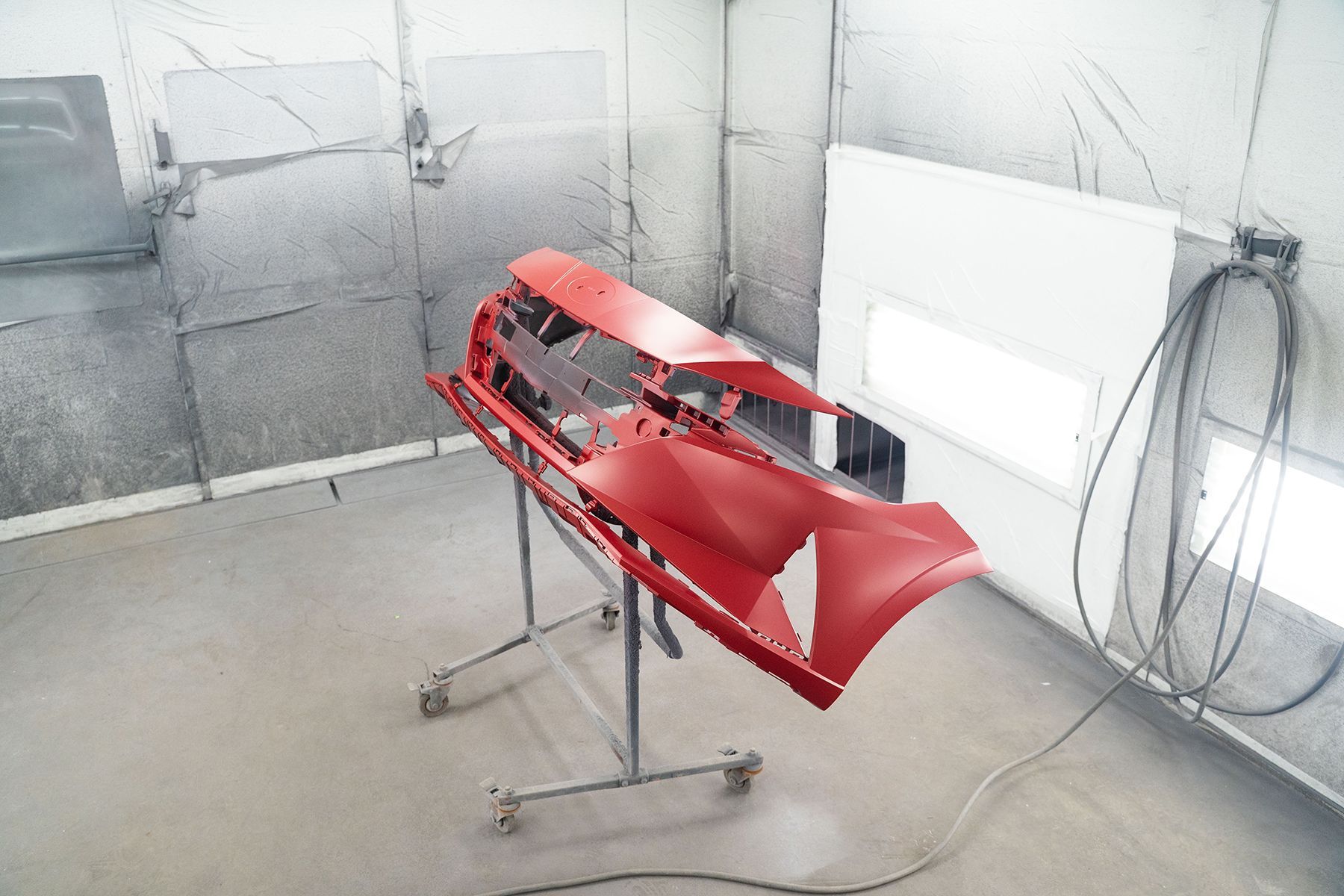 Front of red car prepared for red paint coating in Fishkill, NY | Jimmy's Auto Outlet