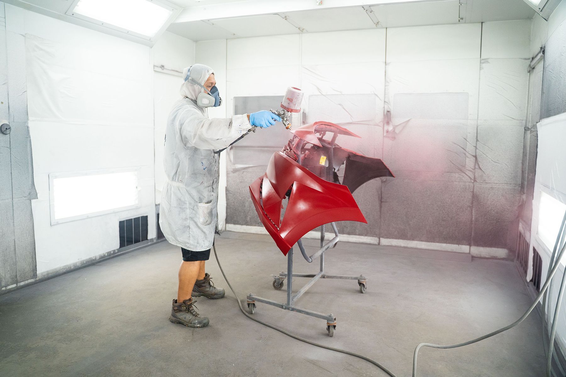 Coating red paint on front of car in Fishkill, NY | Jimmy's Auto Outlet