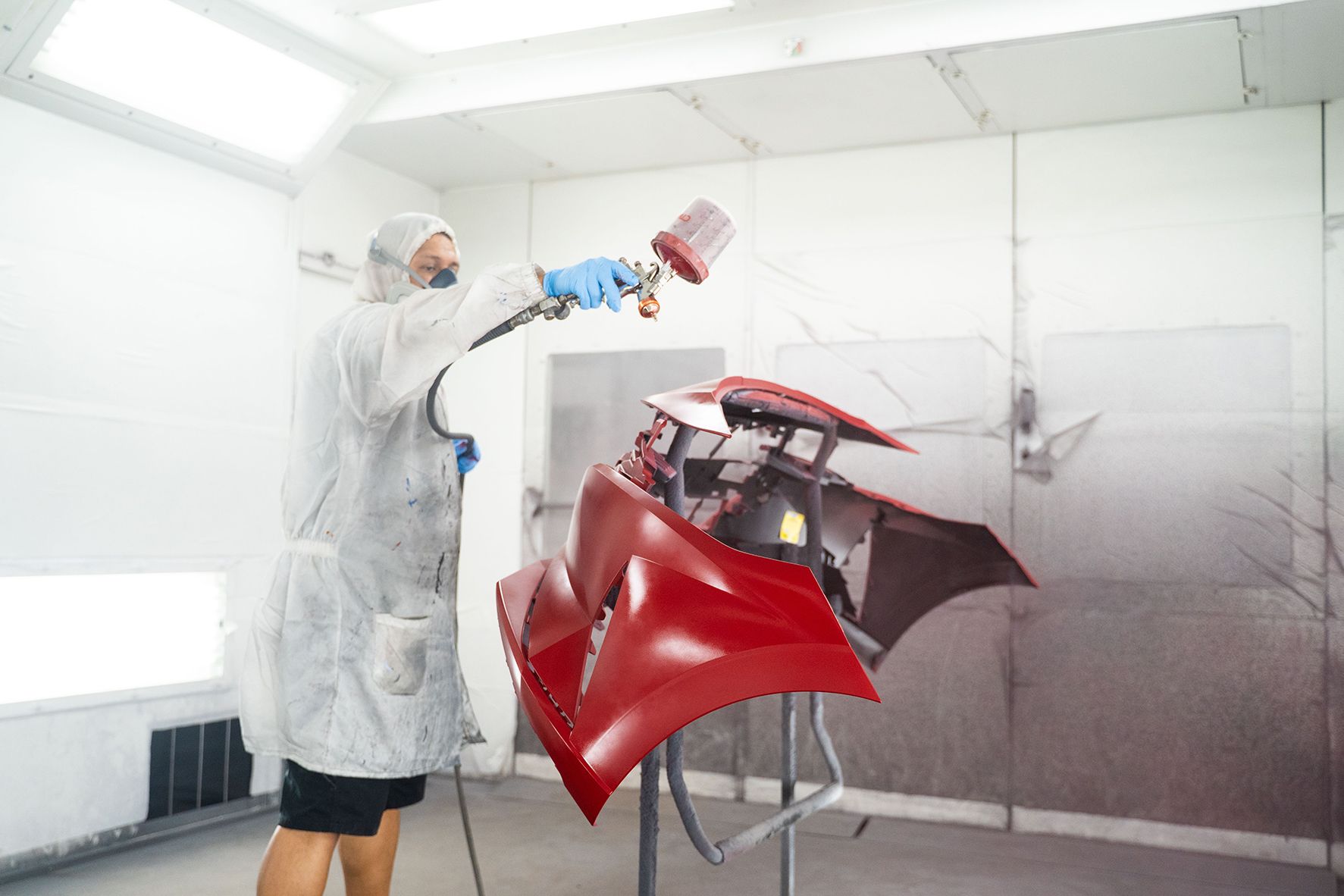 Coating red paint on front of car in Fishkill, NY | Jimmy's Auto Outlet