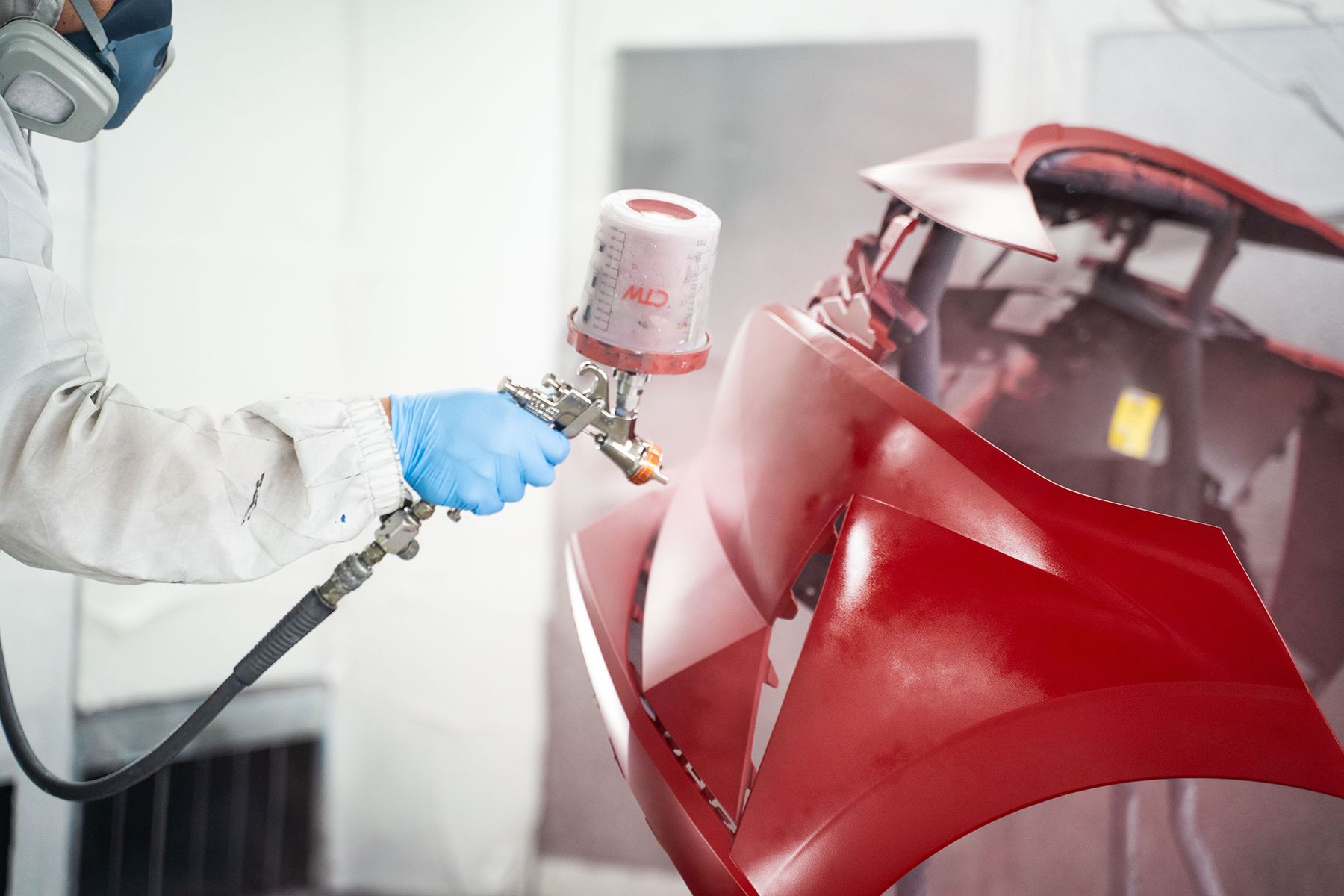 Coating red paint on front of car in Fishkill, NY | Jimmy's Auto Outlet