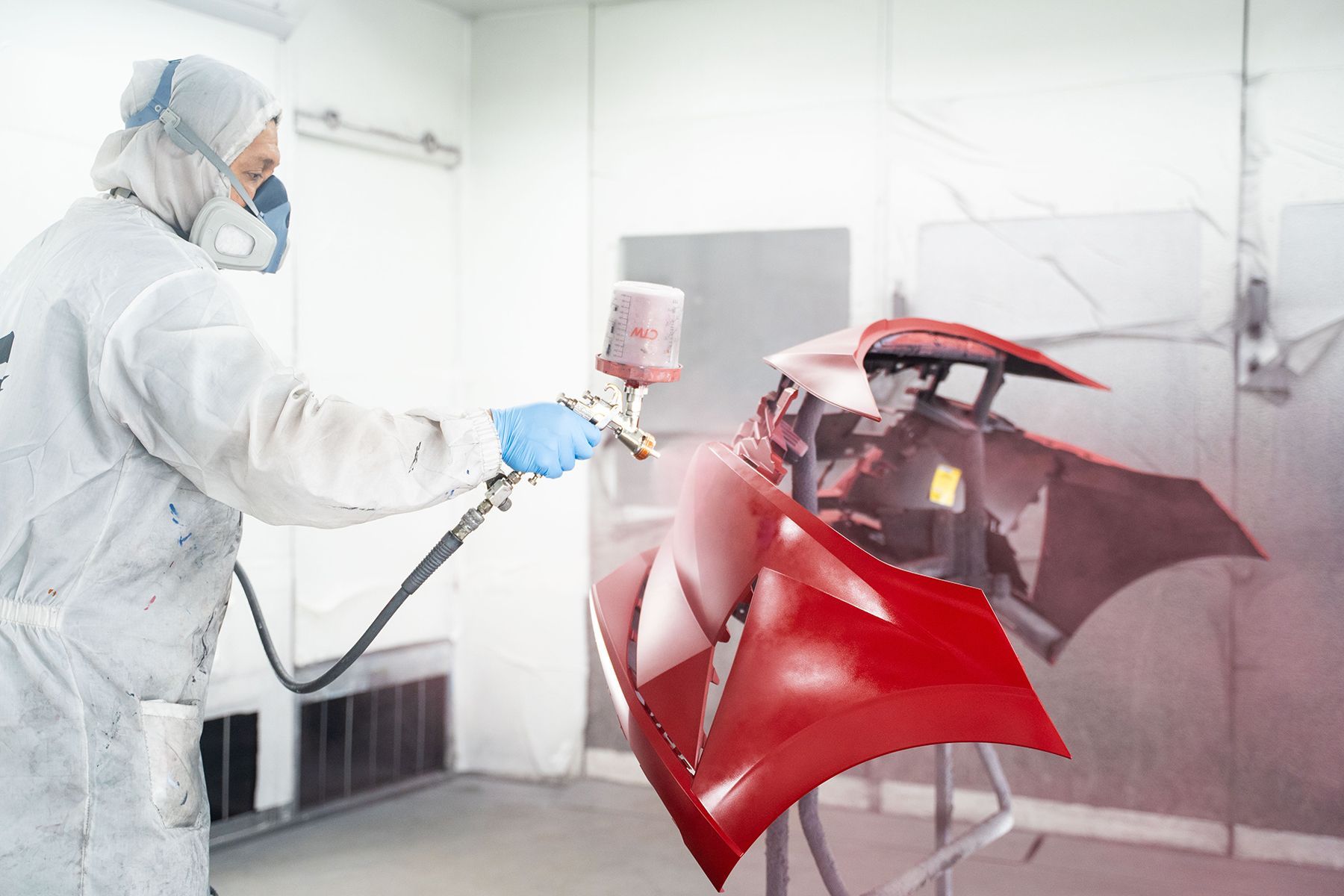 Coating red paint on front of car in Fishkill, NY | Jimmy's Auto Outlet