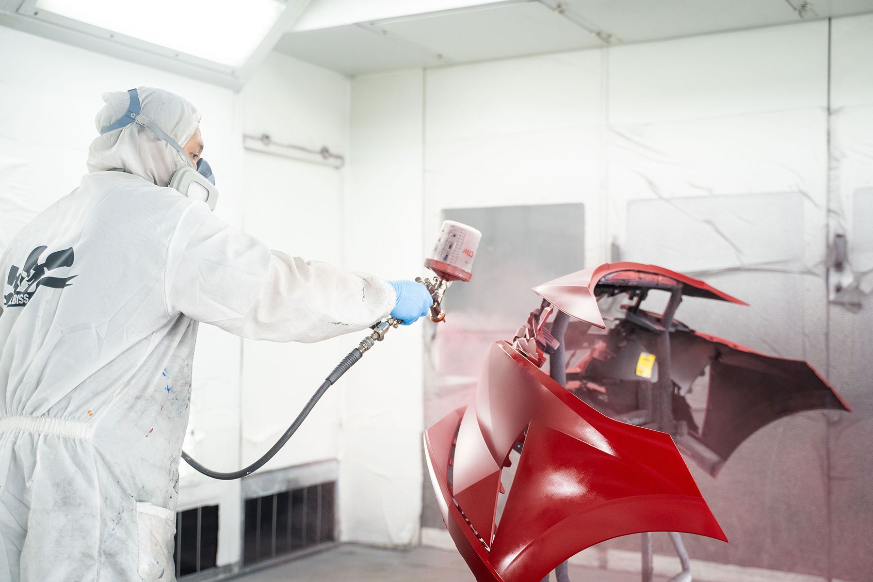 Coating red paint on front of car in Fishkill, NY | Jimmy's Auto Outlet