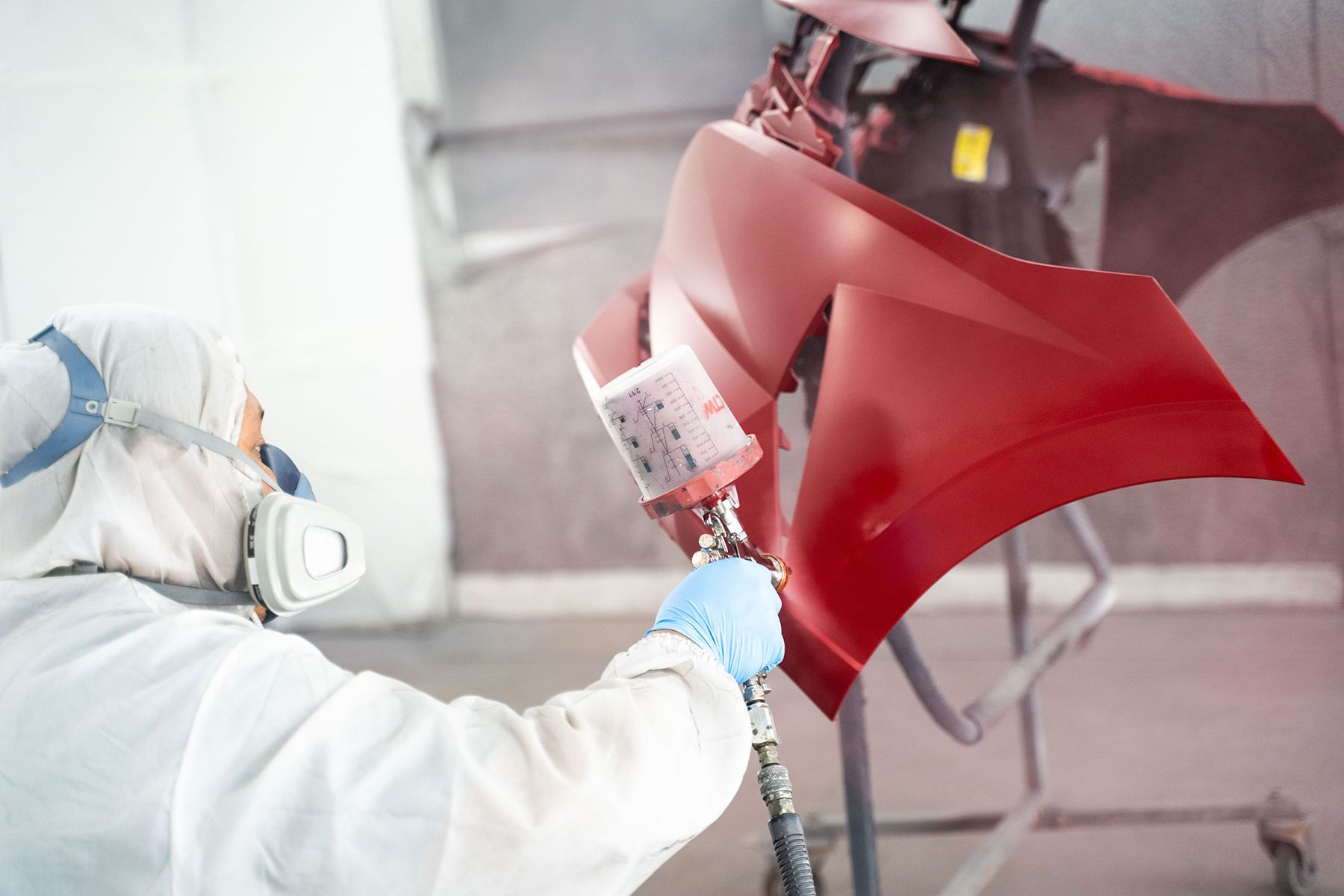 Coating red paint on front of car in Fishkill, NY | Jimmy's Auto Outlet