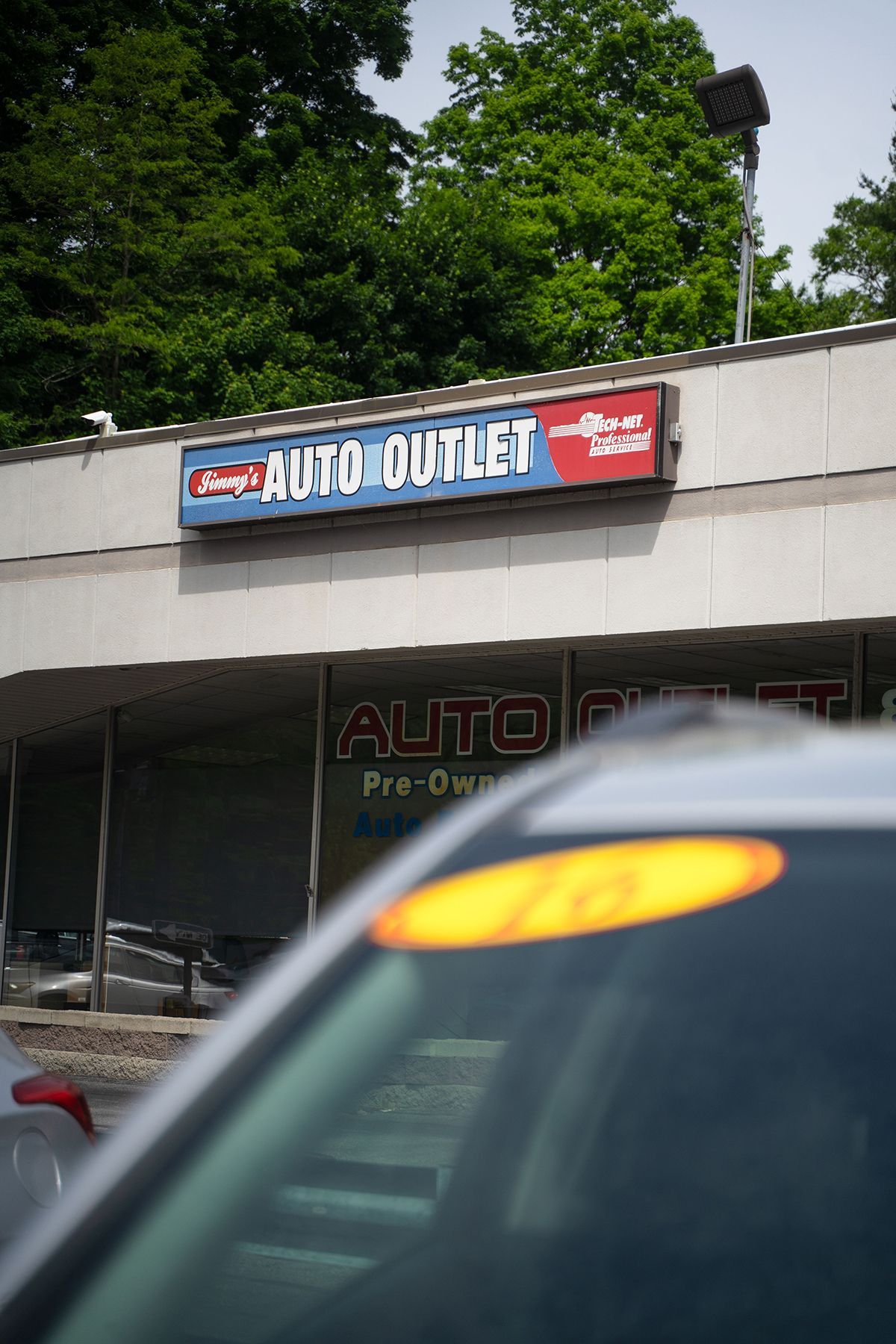 Sign for our shop on top of our shop in Fishkill, NY | Jimmy's Auto Outlet