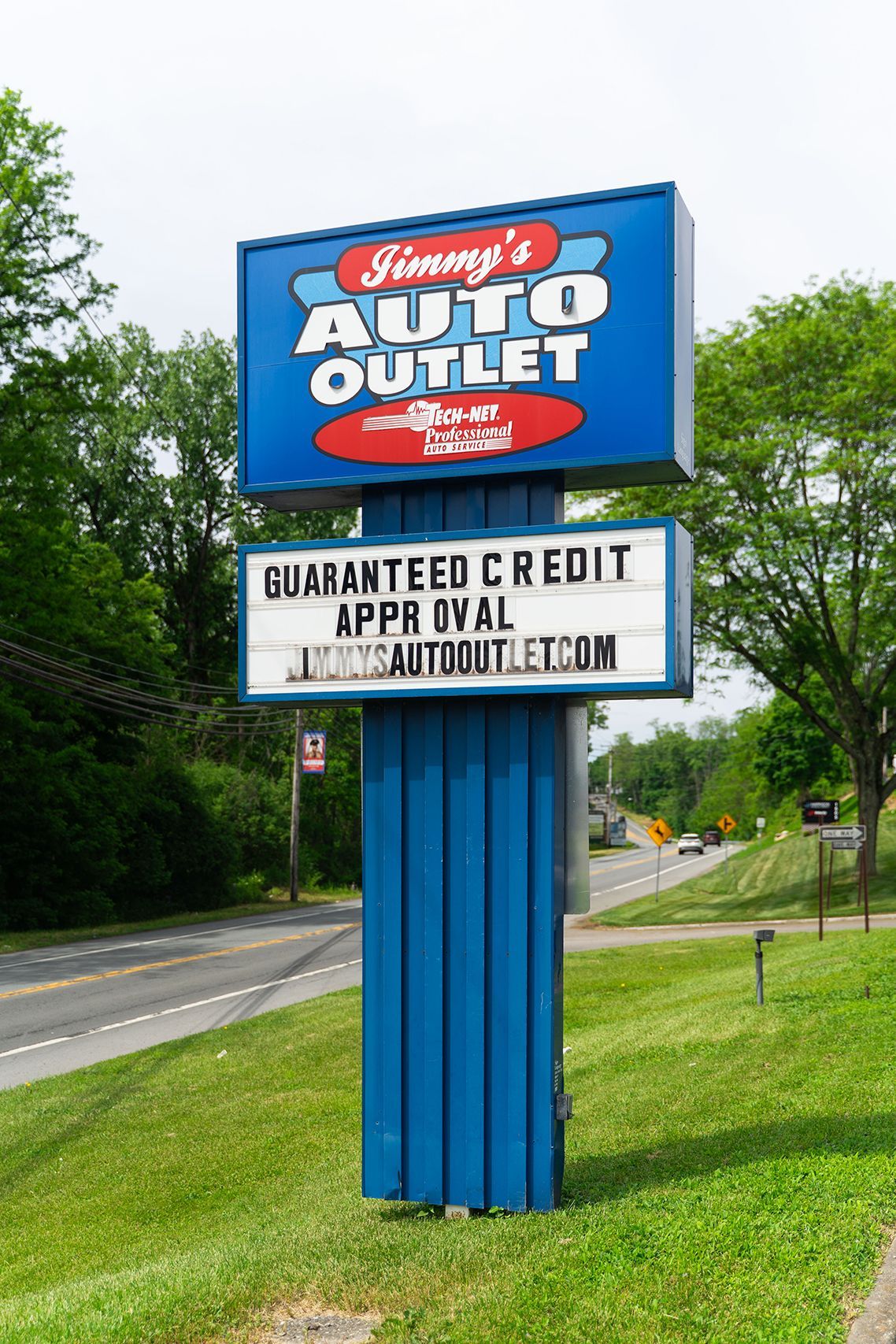 Logo on our shop sign outside in Fishkill, NY | Jimmy's Auto Outlet