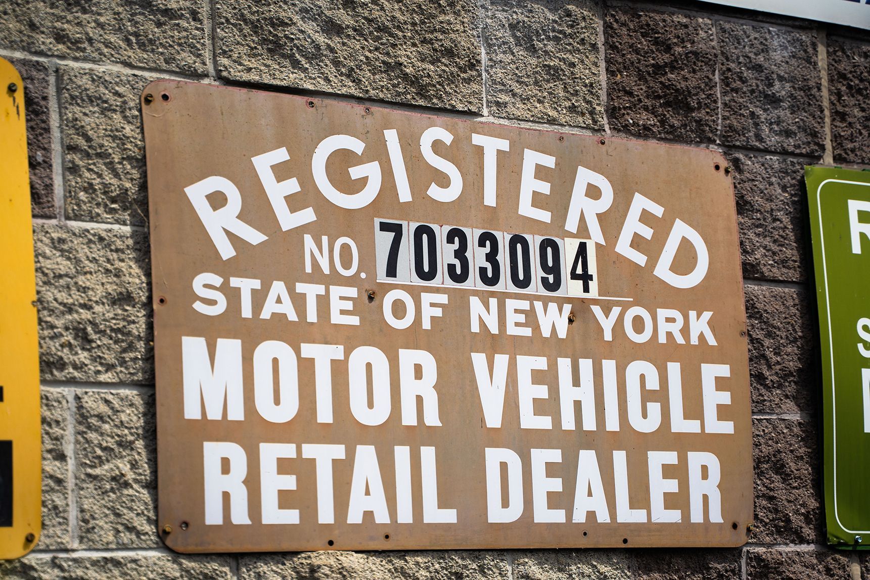 Registered State of New York Motor Vehicle Retail Dealer sign outside our shop in Fishkill, NY | Jimmy's Auto Outlet