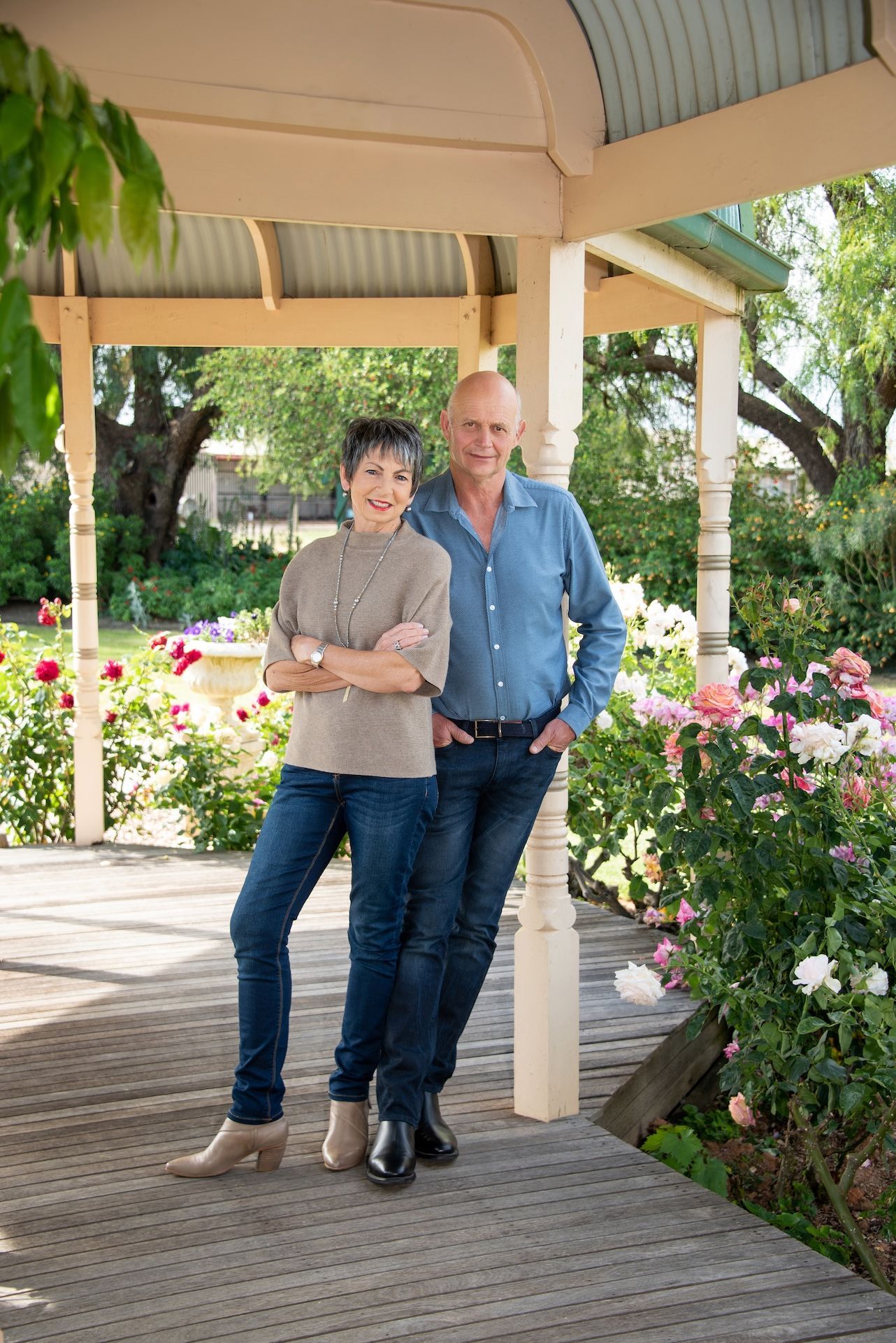 A Man and a Woman Are Standing Next to Each Other and Smiling — Dale Wright Portrait Maker in Shepparton, VIC