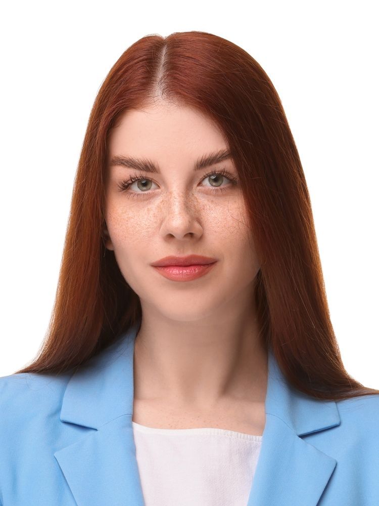 A Woman With Red Hair and Freckles is Wearing a Blue Jacket — Dale Wright Portrait Maker in Shepparton, VIC